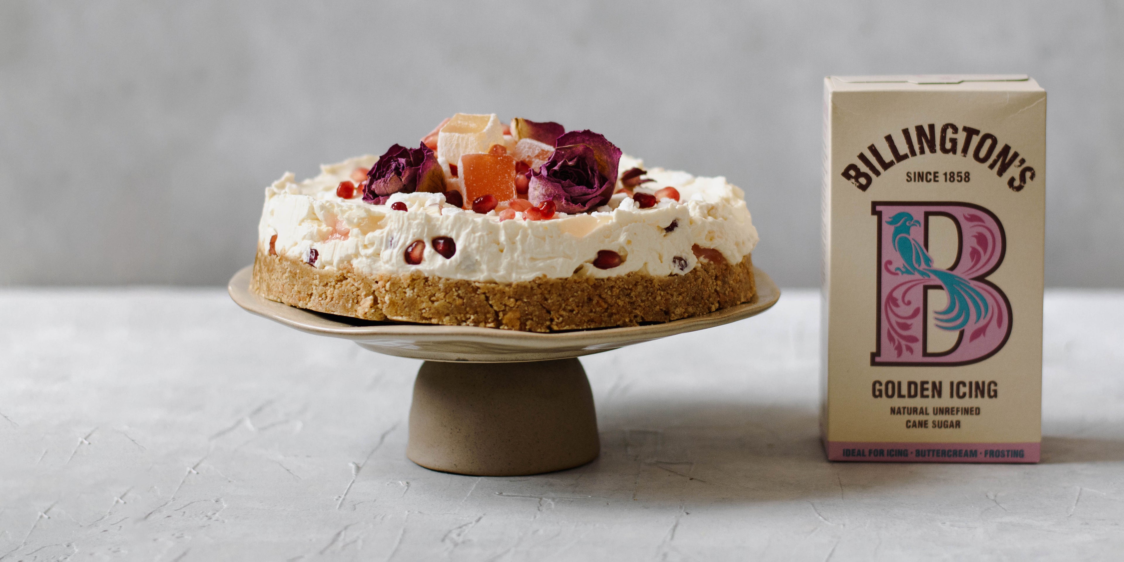 Turkish Delight Cheesecake on cake stand with sugar pack