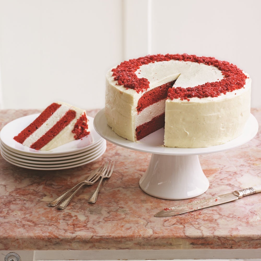 Red velvet cheesecake cake with layers of red velvet cheesecake filling and red velvet sponge