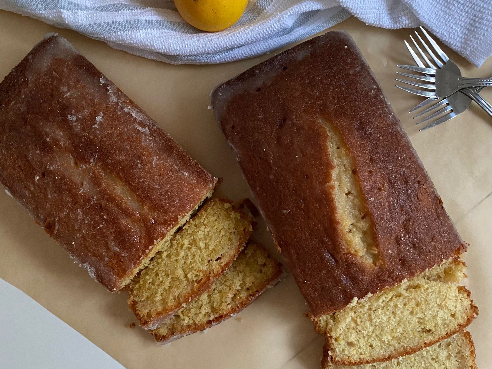 Mary Berry and Nigella Lawson's lemon drizzle cakes with slices cut