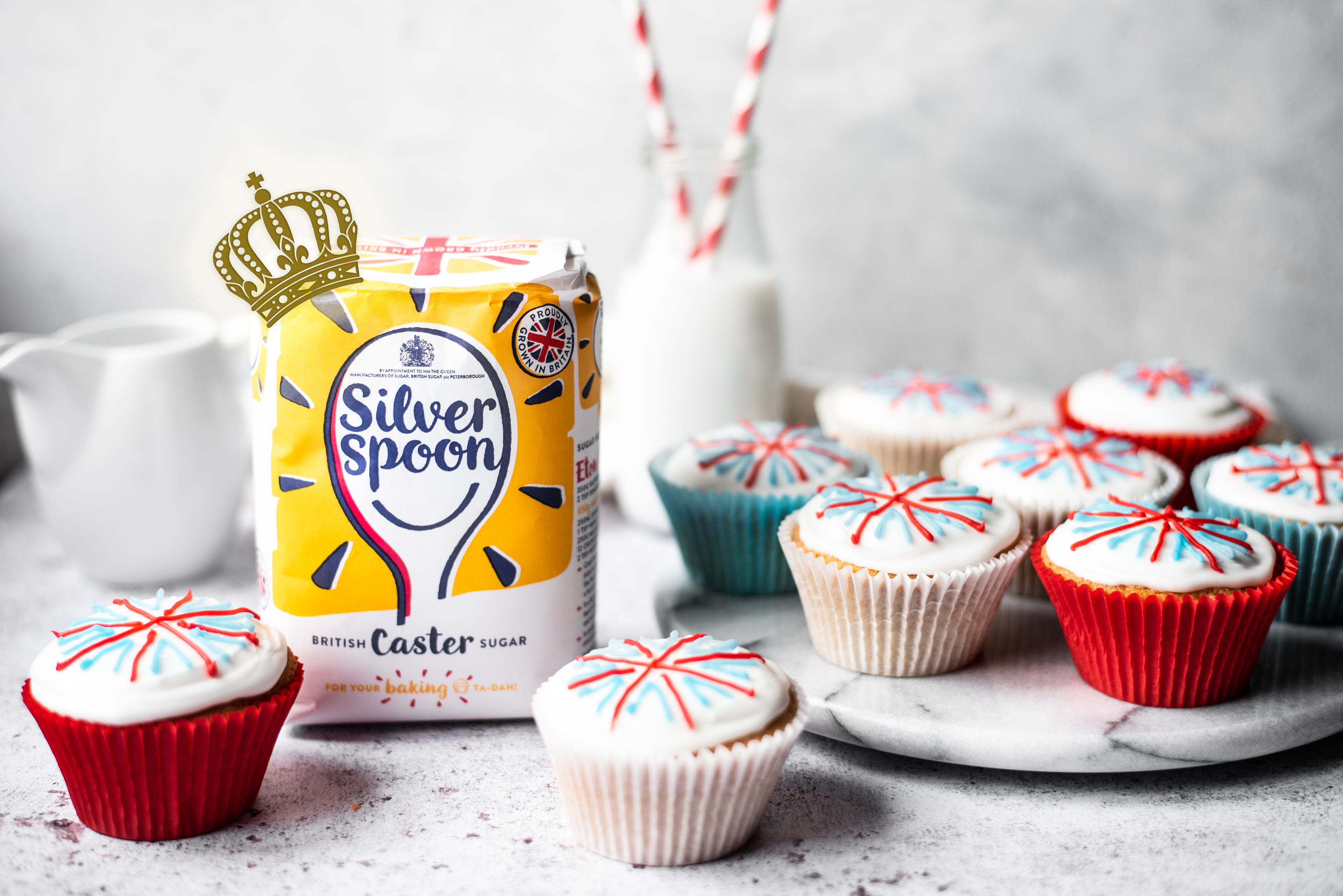 Union jack cupcakes, next to a bag of Silver Spoon caster sugar, with a hidden royal crown logo