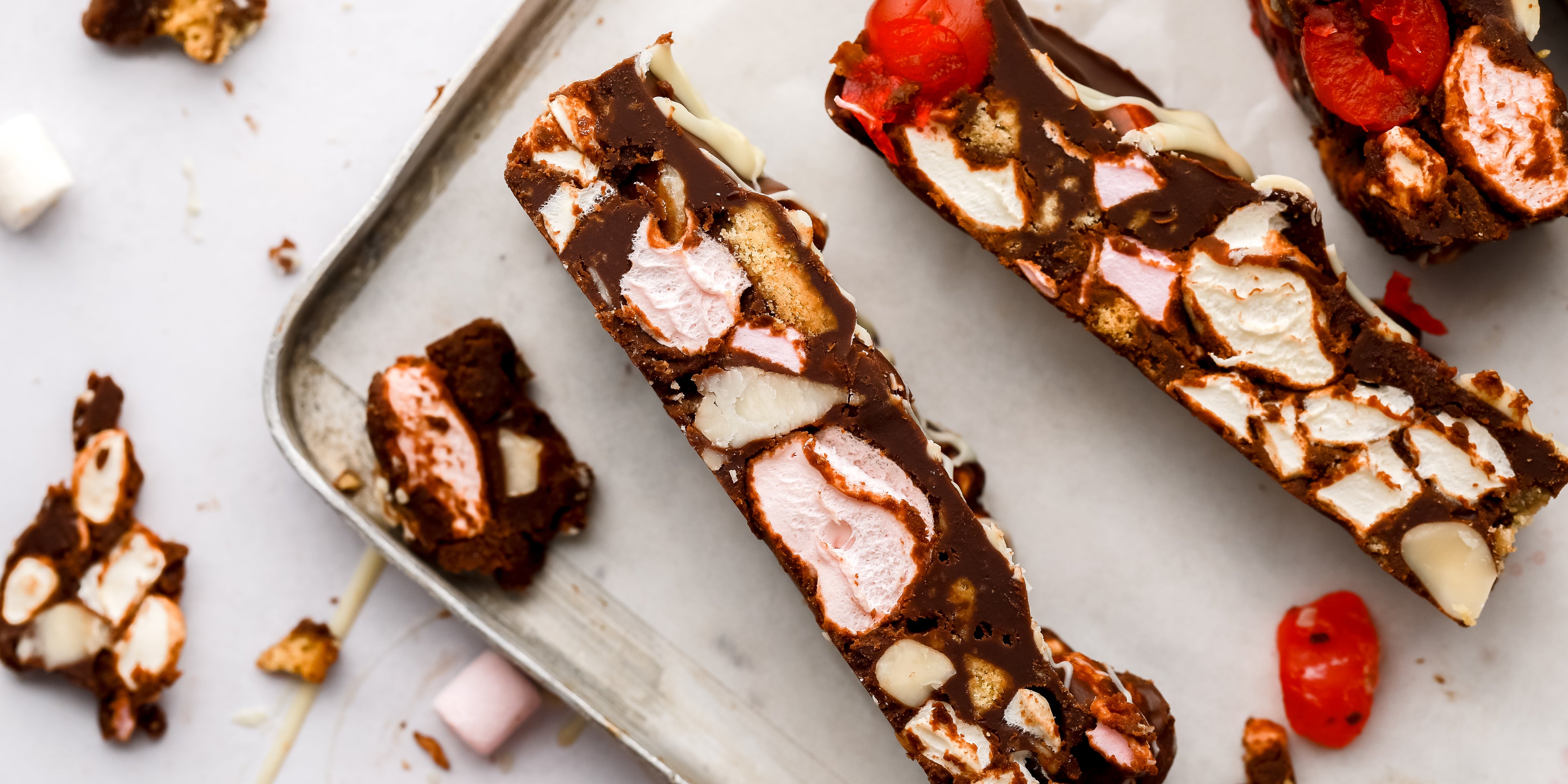 Close up of slices of rocky road showing cherries and marshmallows