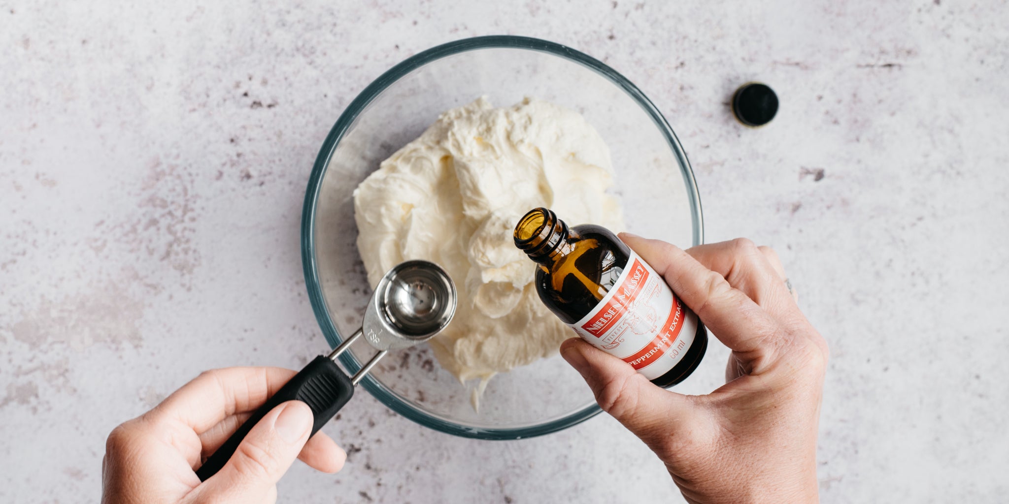 Chocolate & Peppermint Cupcake buttercream being whipped together with a dollop of Nielsen Massey Peppermint Extract