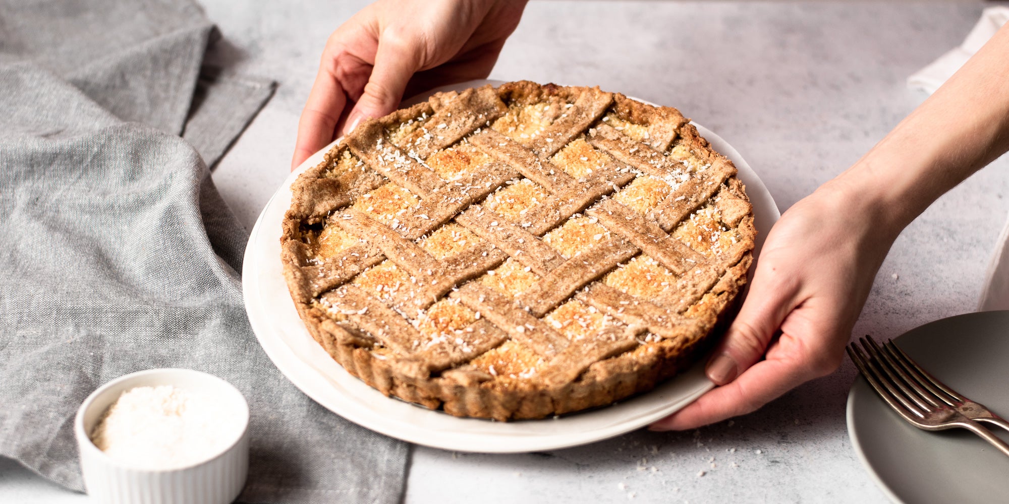 person holding coconut tart