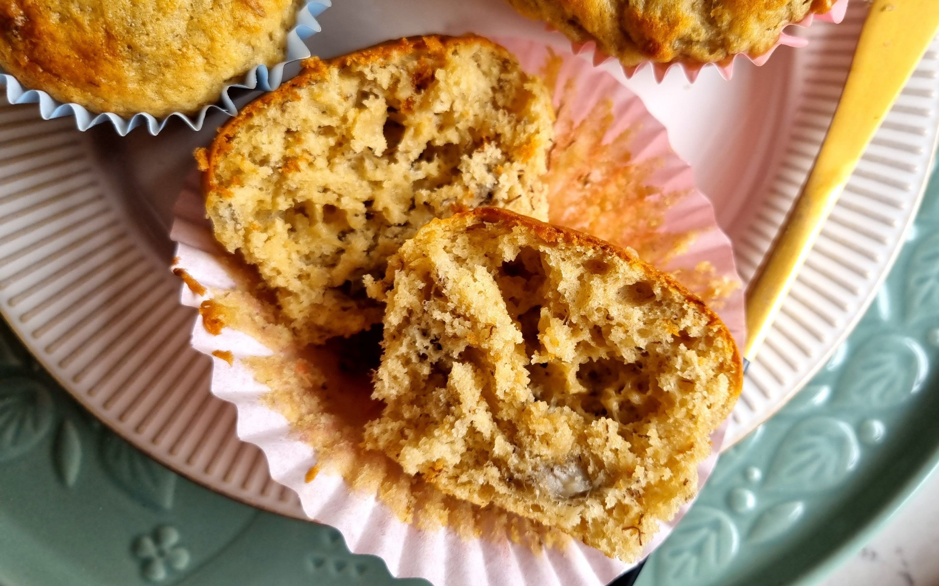 Freshly-baked banana muffins sliced in half