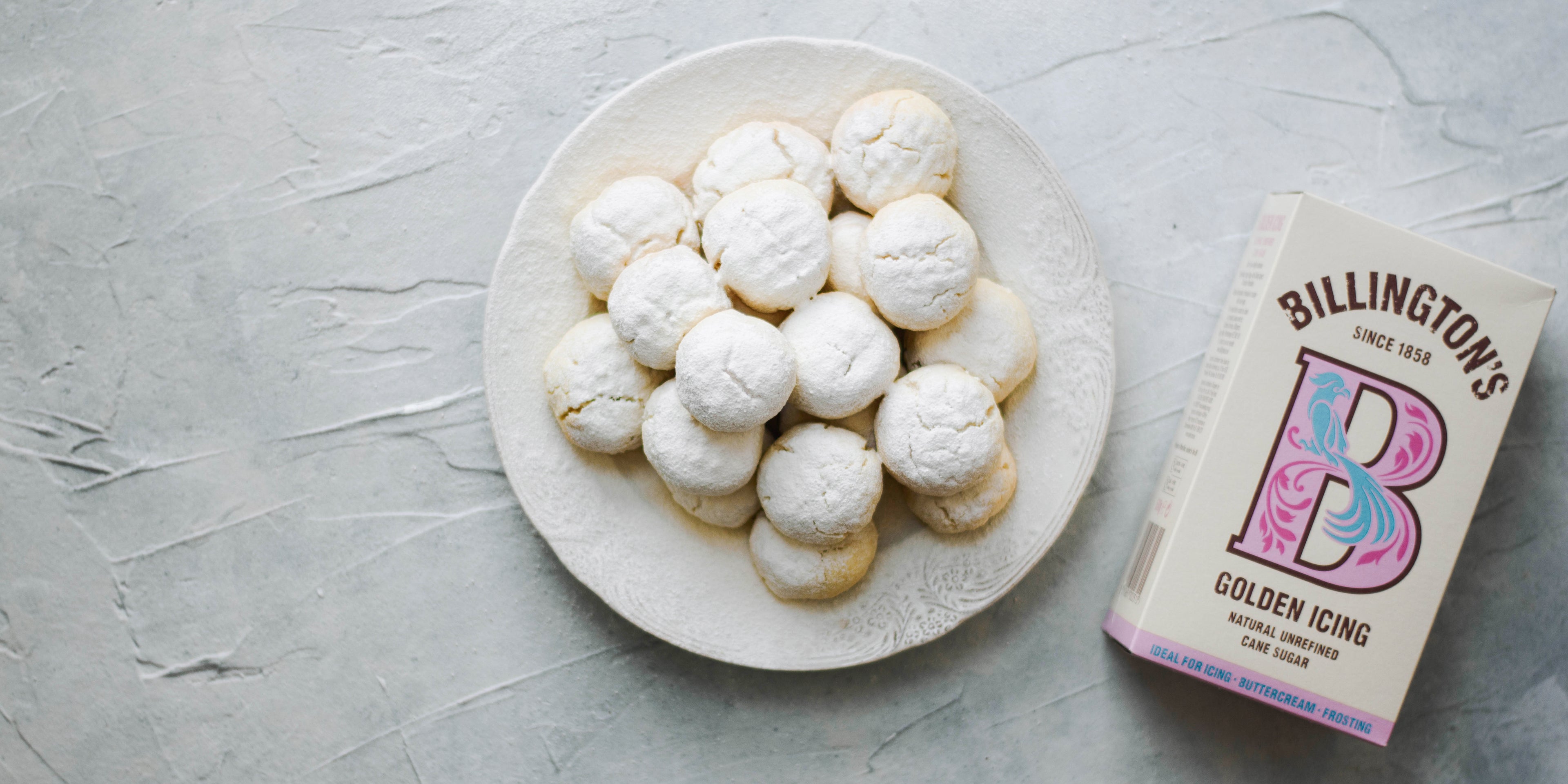 Kahk Eid 3 on a plate with a dusting for Billington's Golden Icing sugar