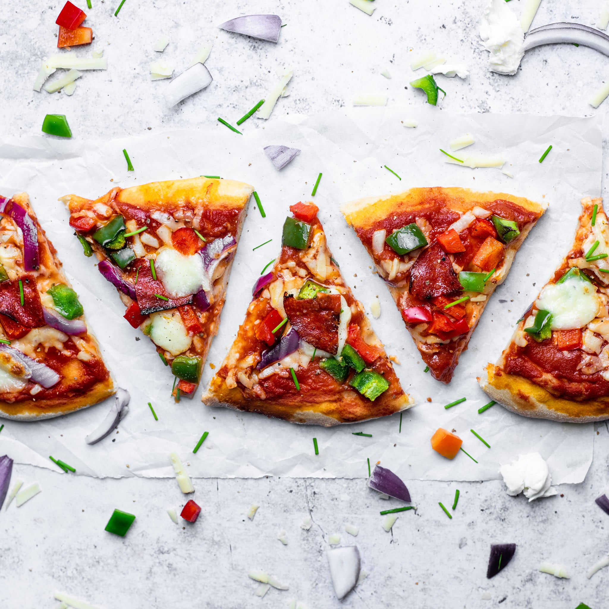 A line of single vegetarian pizza slices made from allinson's bread flour for pizza bases