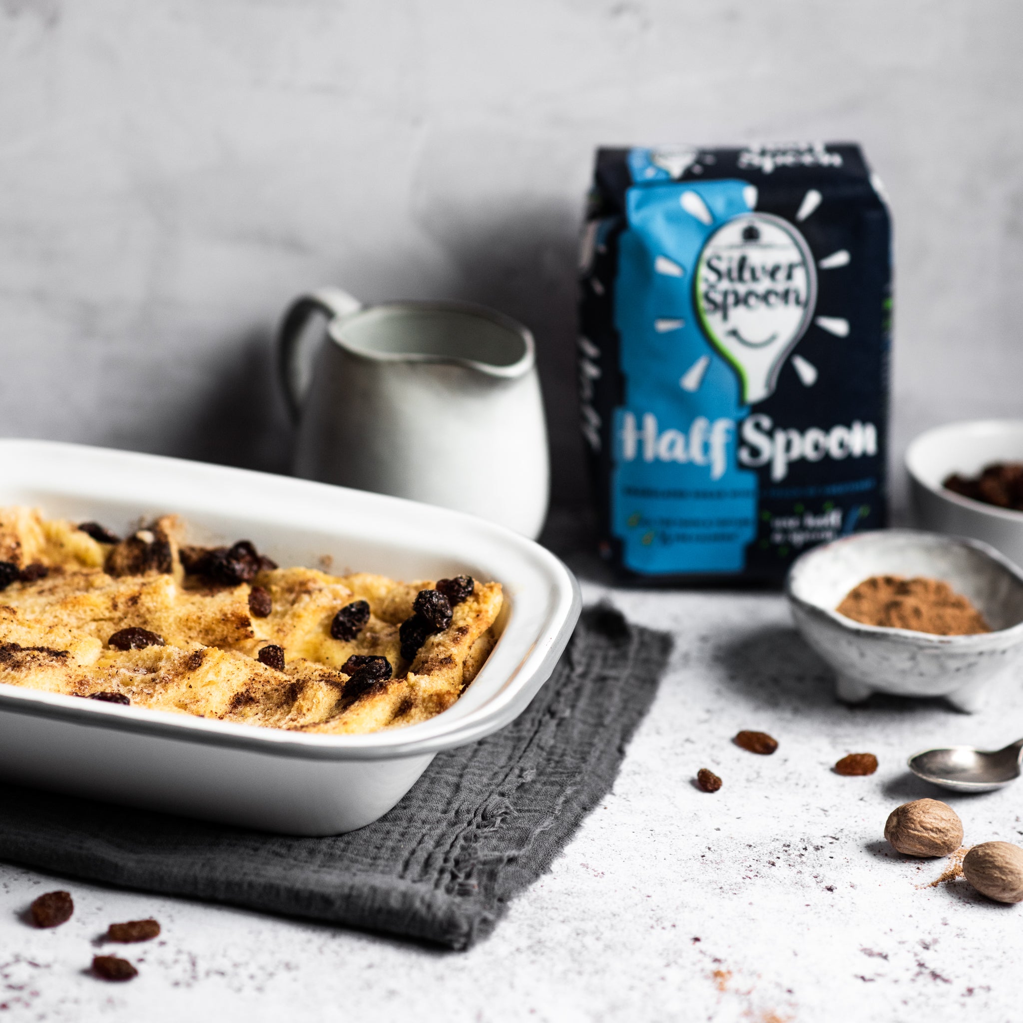 Bread and butter pudding in a tin with raisins