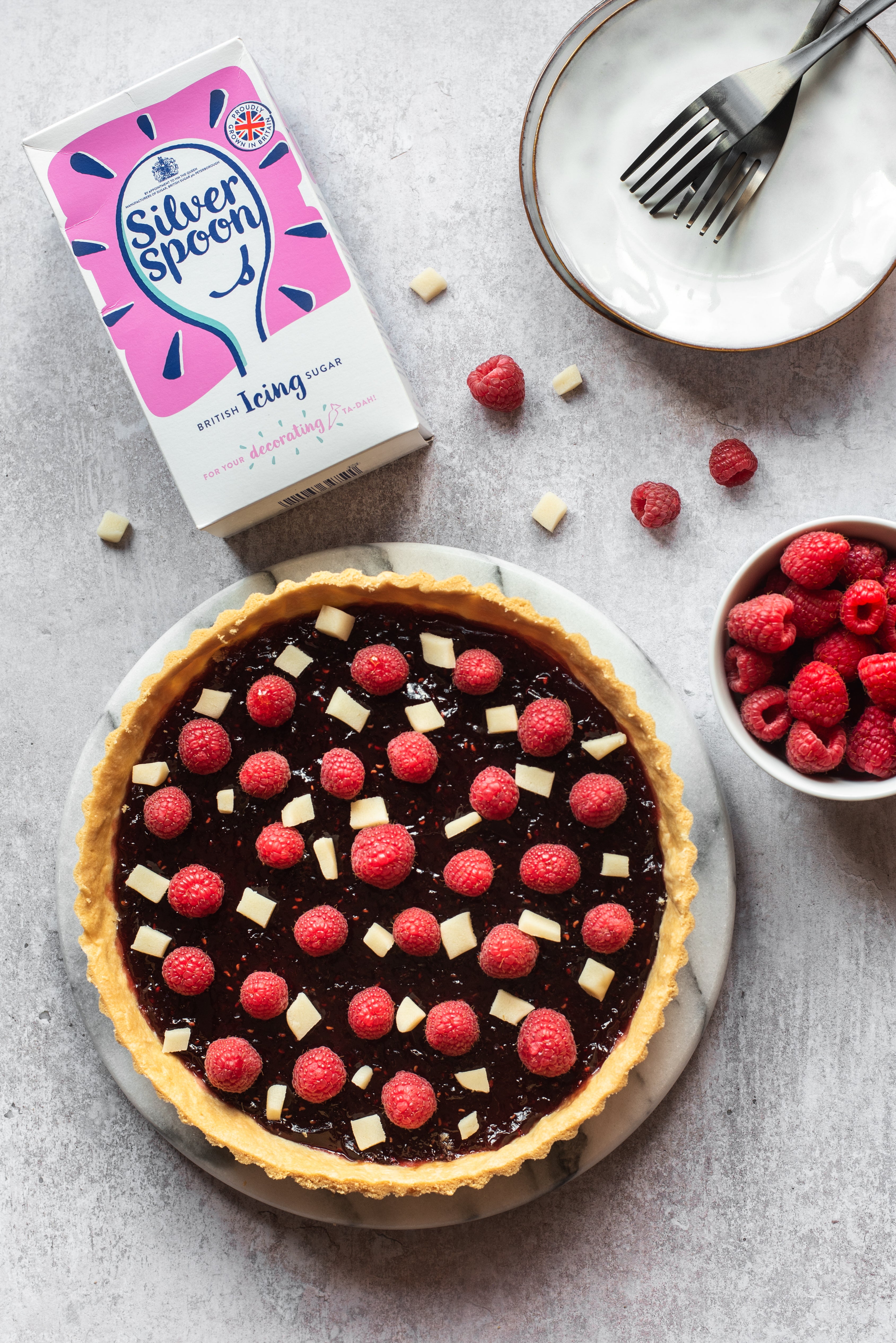 Jam tart topped with raspberries