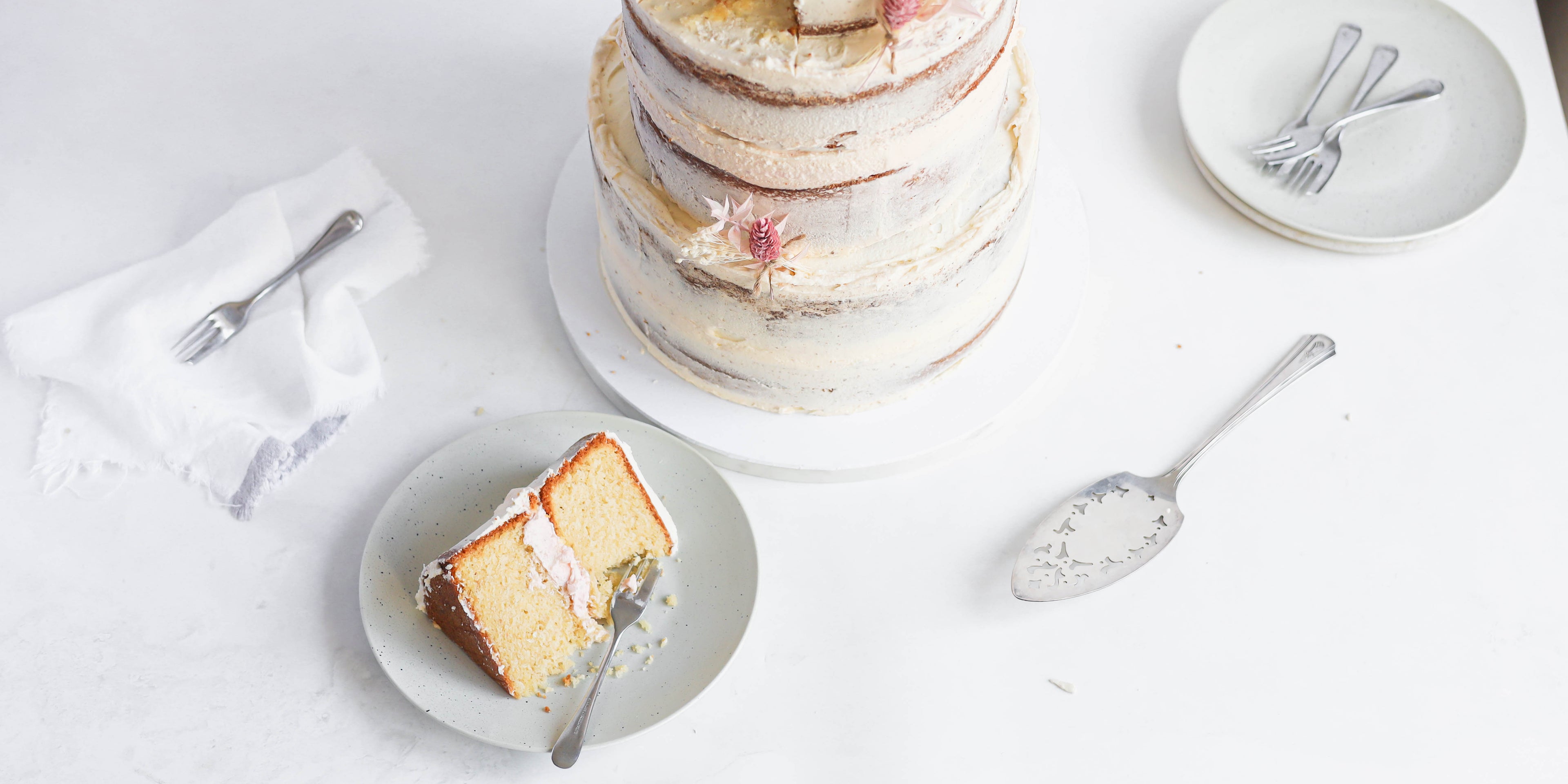 Top down view of a slide of a naked vanilla celebration cake