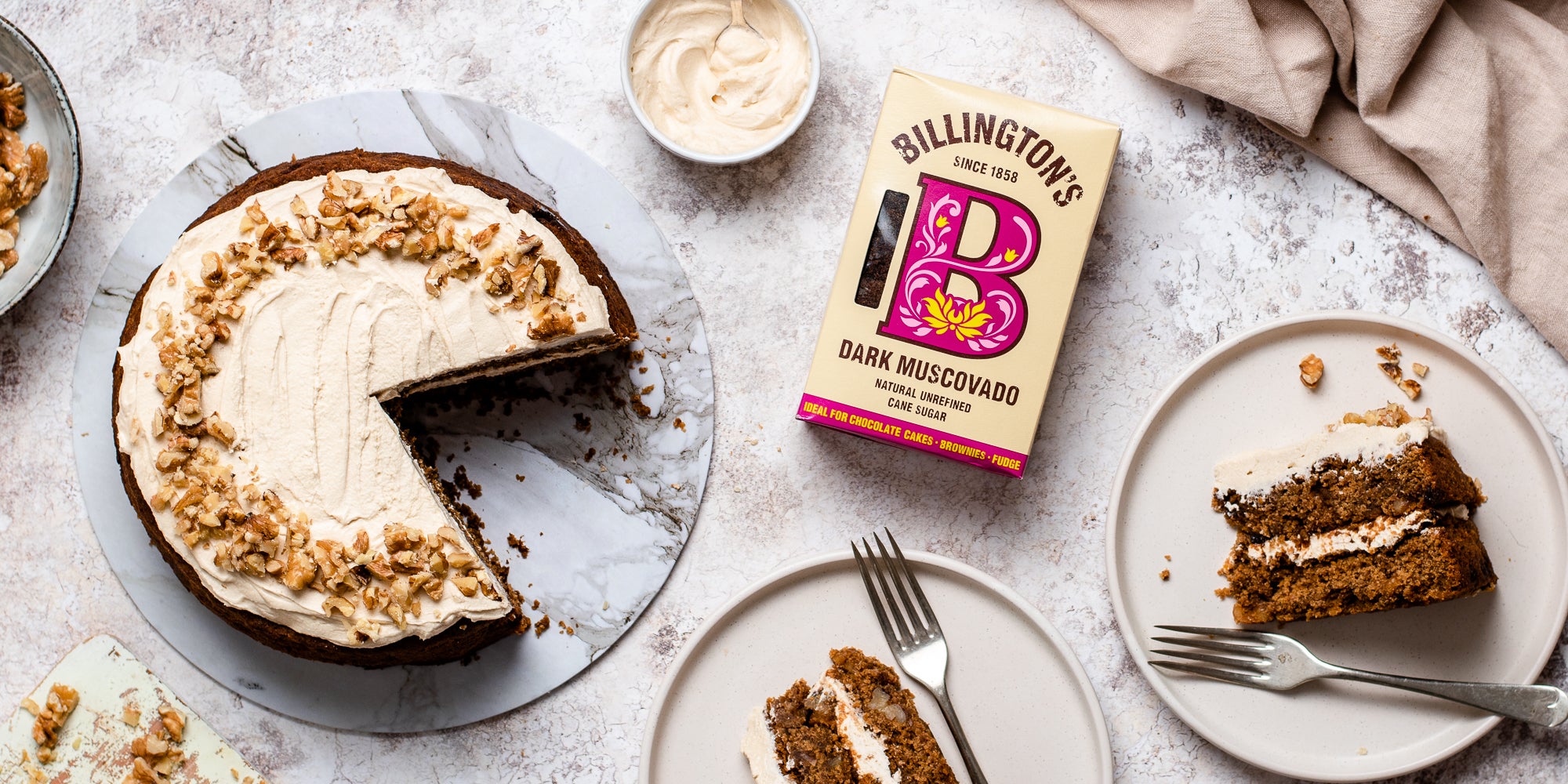 Gluten Free Vegan Coffee Cake with a slice cut out of it next to a box of Billington's Dark Muscovado sugar