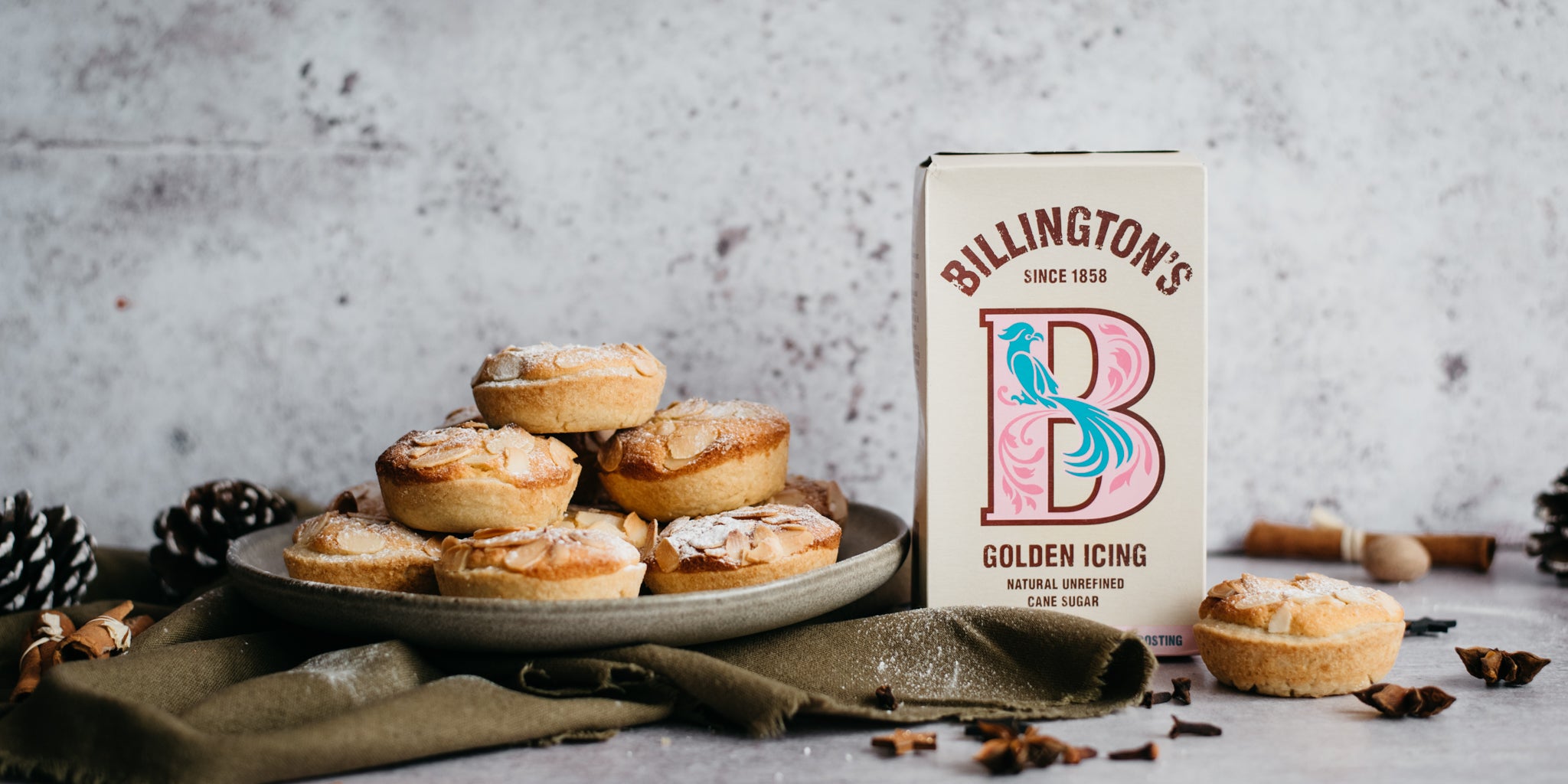 Frangipane Mince Pies by Benjamina, next to a box of Billington's Golden Icing sugar, next to a mine pie half eaten