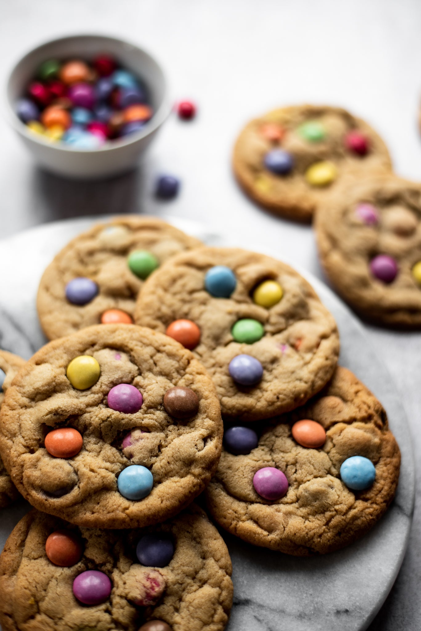 A close up plate of smarties copycat millies cookies