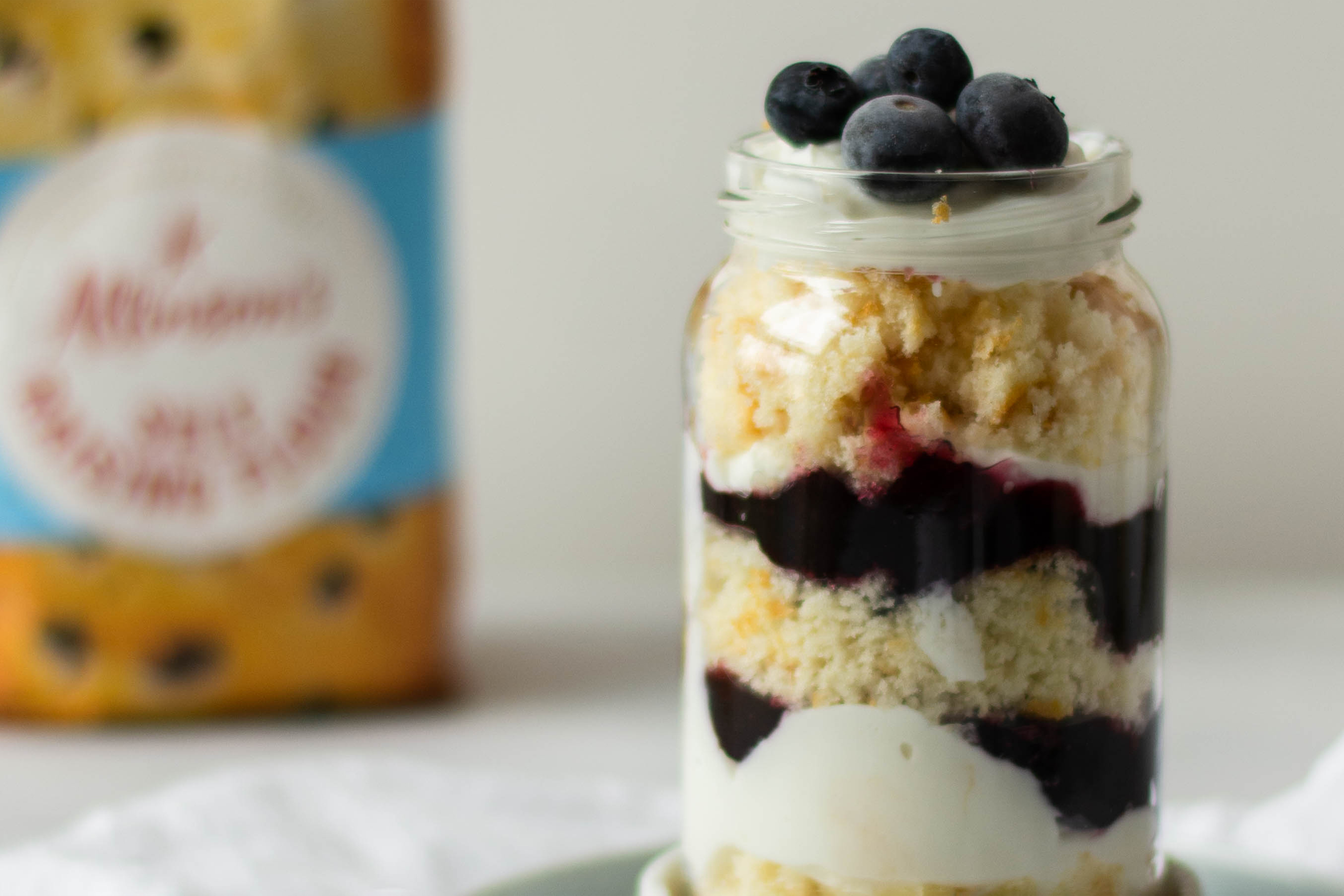 Lemon & Blueberry Cake Jar close up, with a bag of Allinson's Self Raising flour in the background