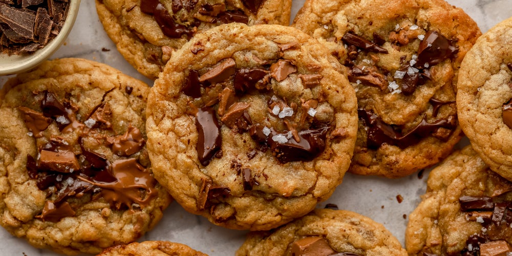 Close up of a pile of homemade Millie’s chocolate chip cookies