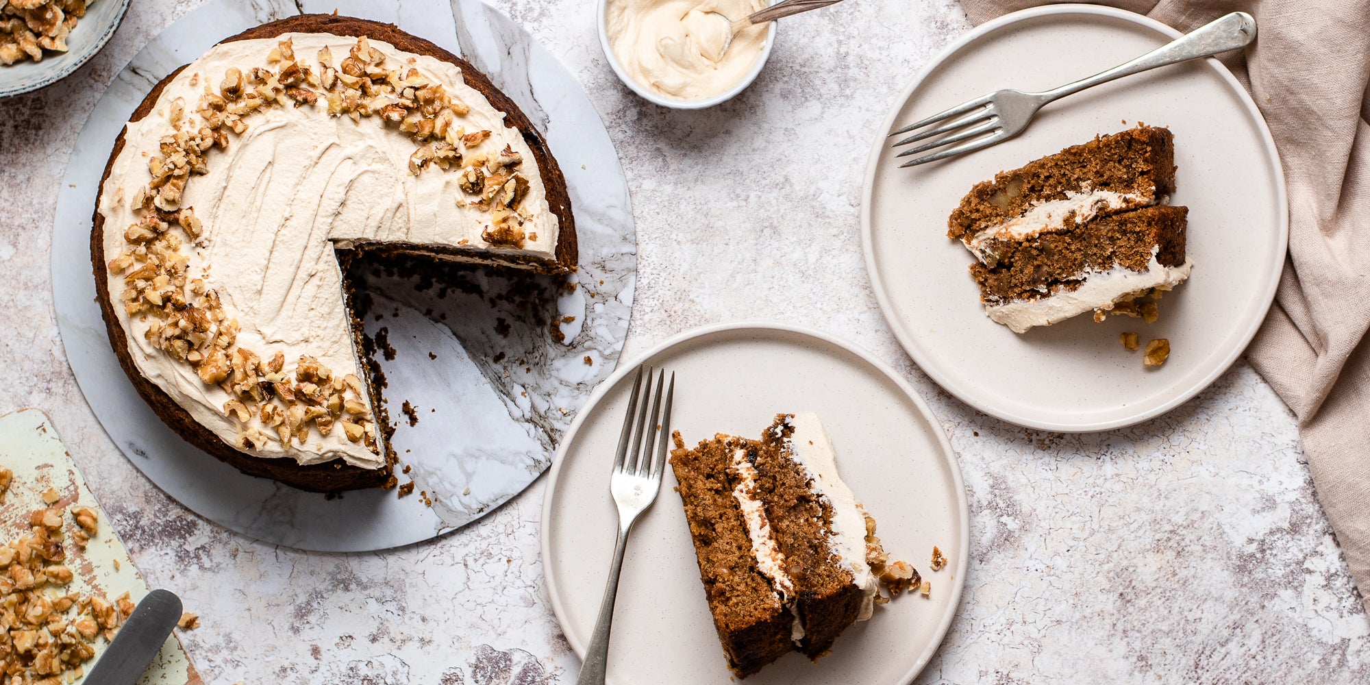 Flay lay view of Gluten Free Vegan Coffee Cake with slices cut out, and lay on a plate ready to serve with a fork