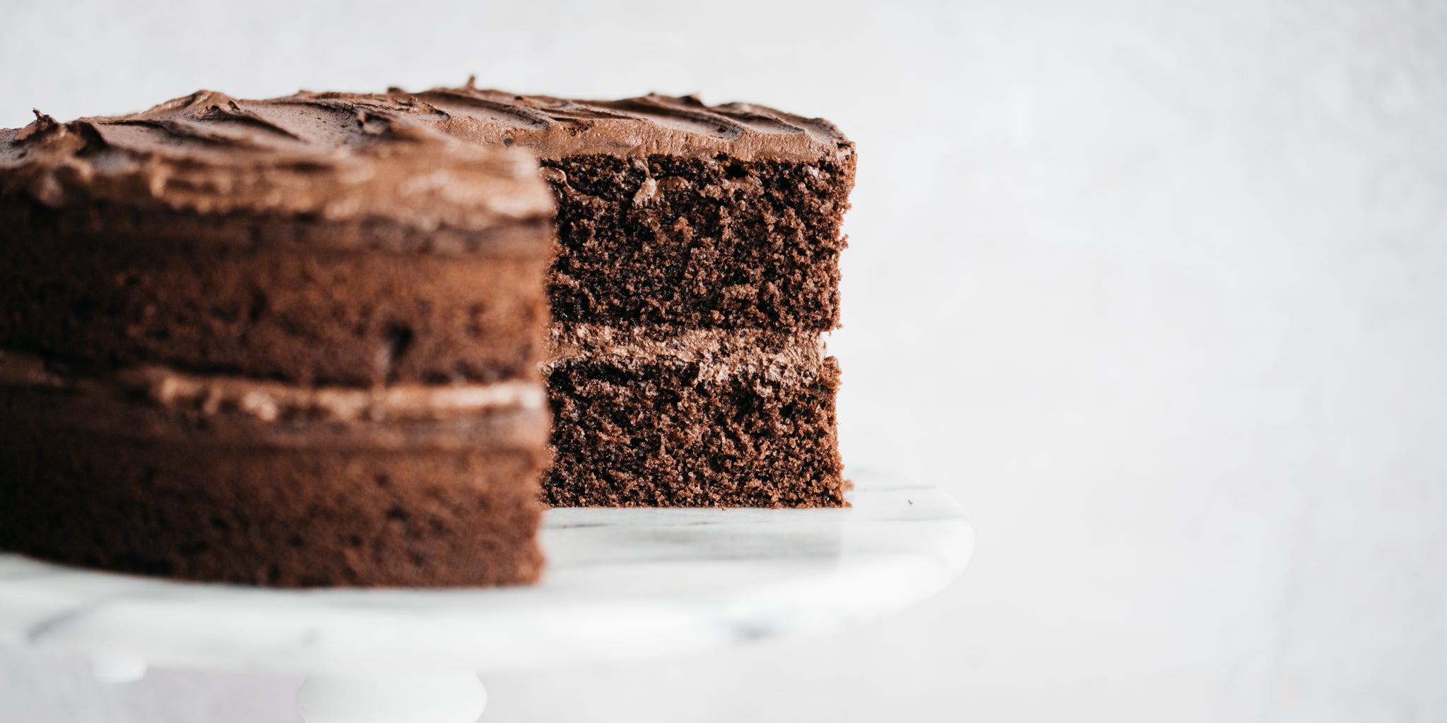 Close up of chocolate cake with a slice removed from it