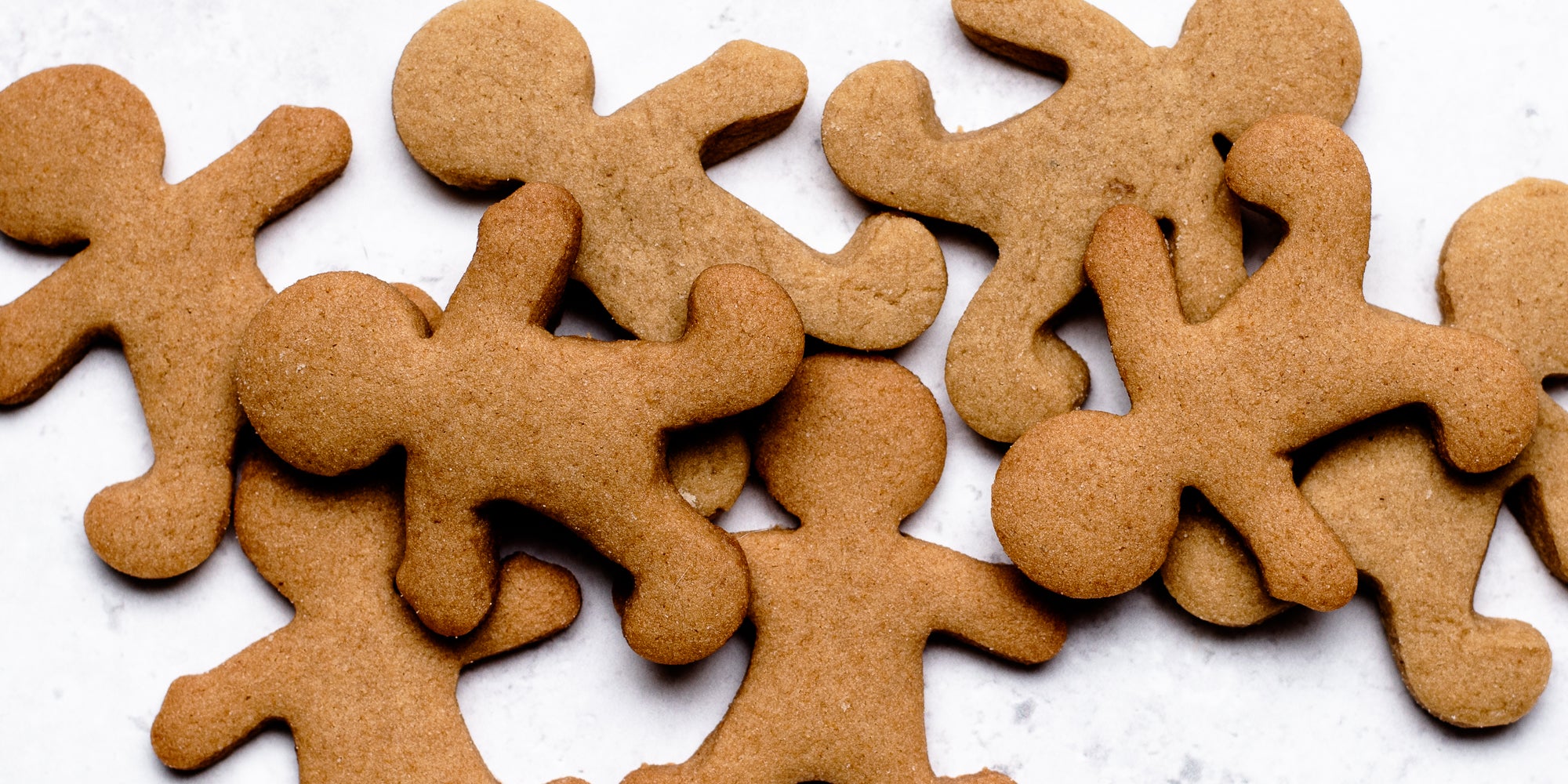 A batch of Gingerbread Dough gingerbread men baked in the oven.