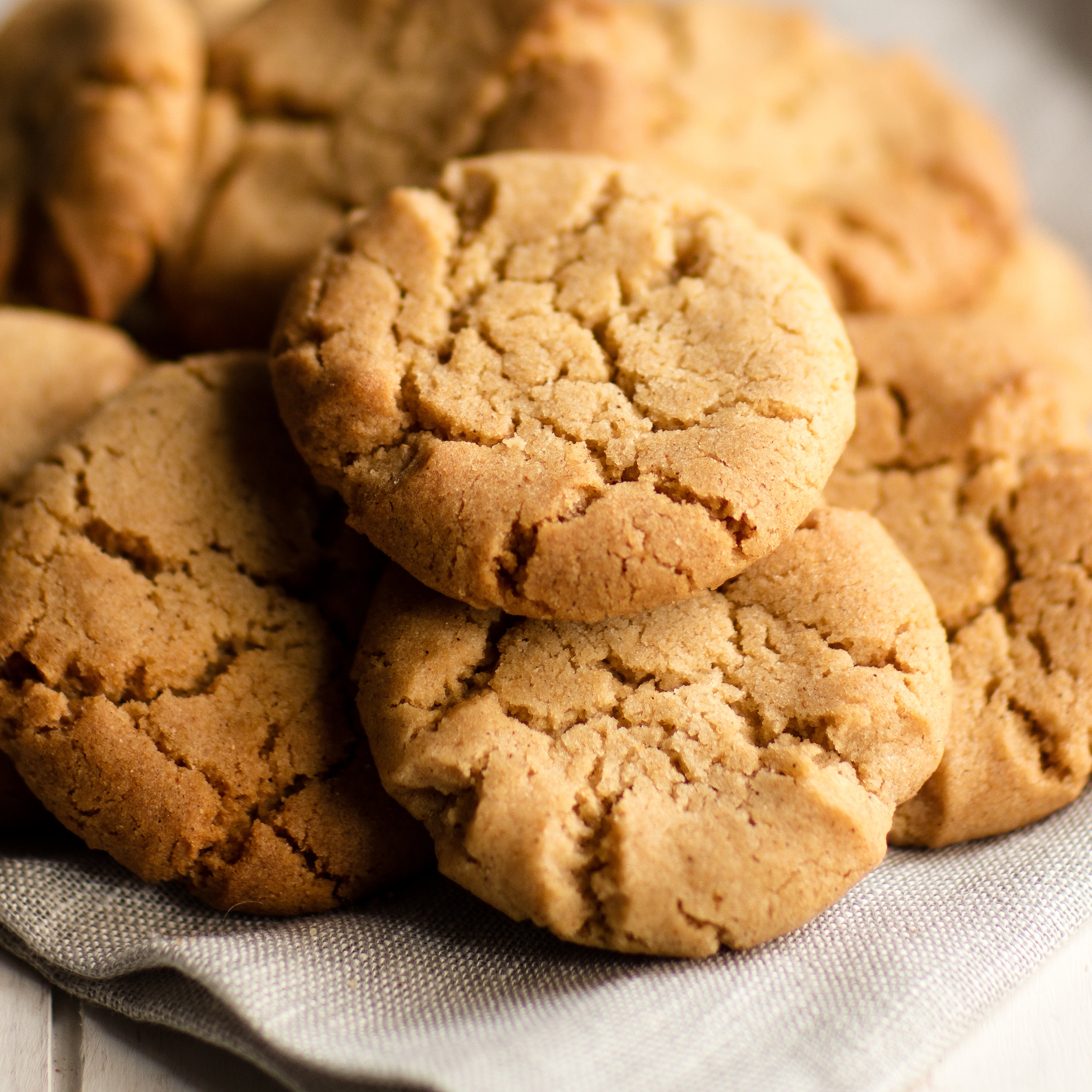 Close up of piles of biscuits stacked on cloth napkin