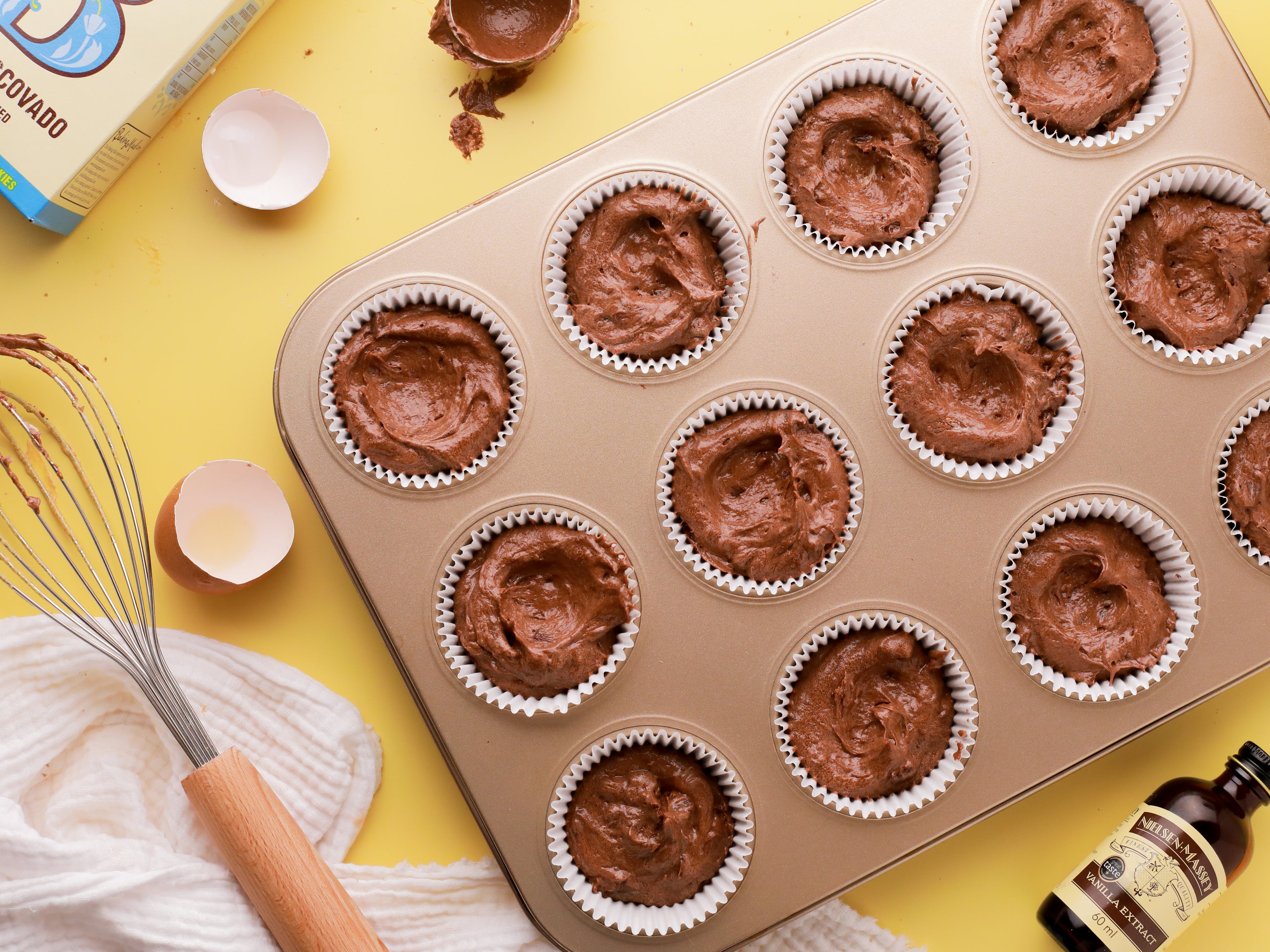 Chocolate cupcake batter in a baking tin