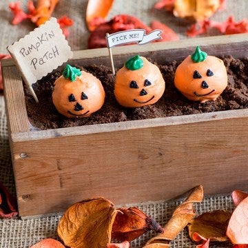 pumpkin cake pops in a row