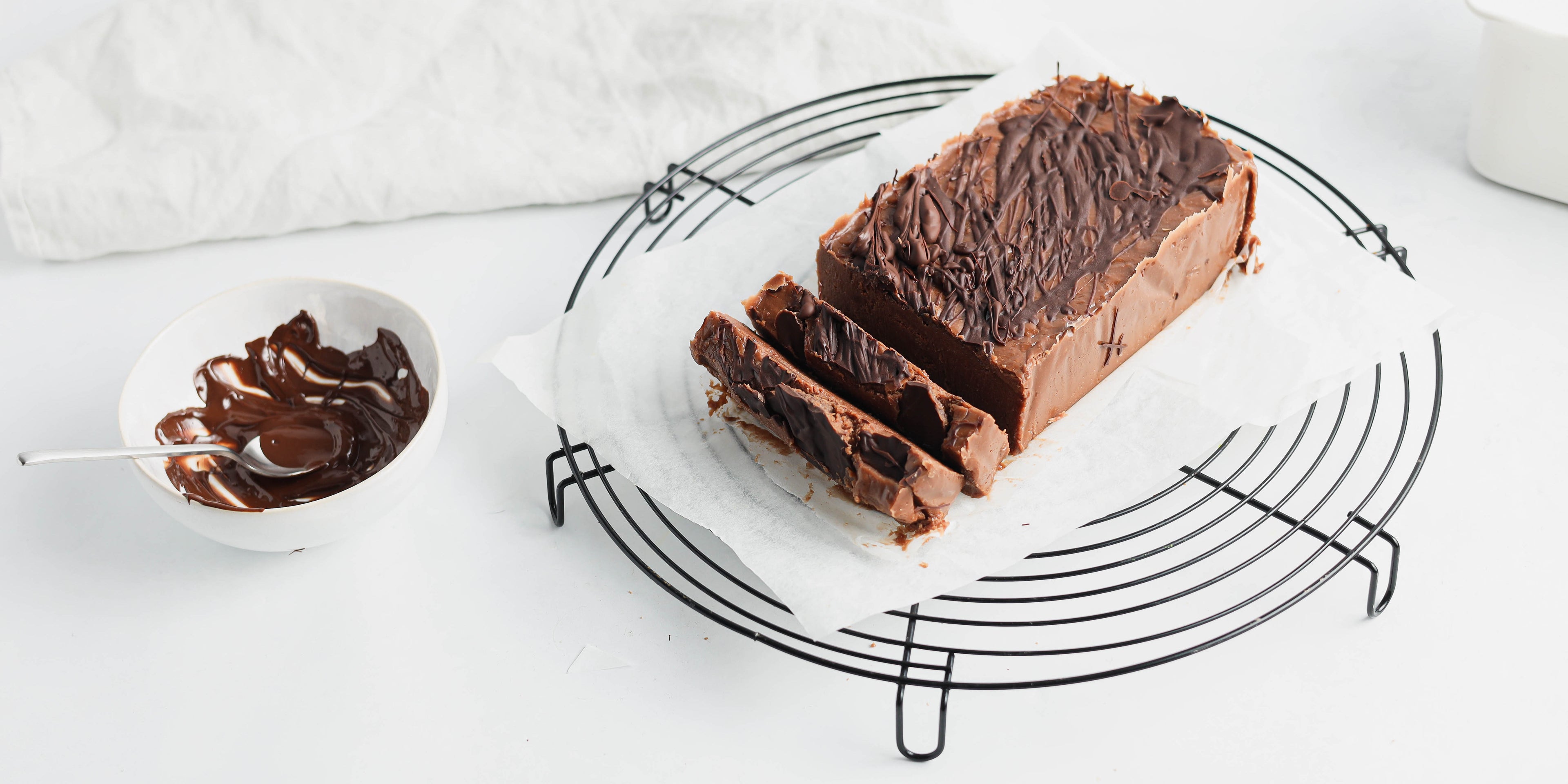 Side on view of chocolate halva sliced on a plate