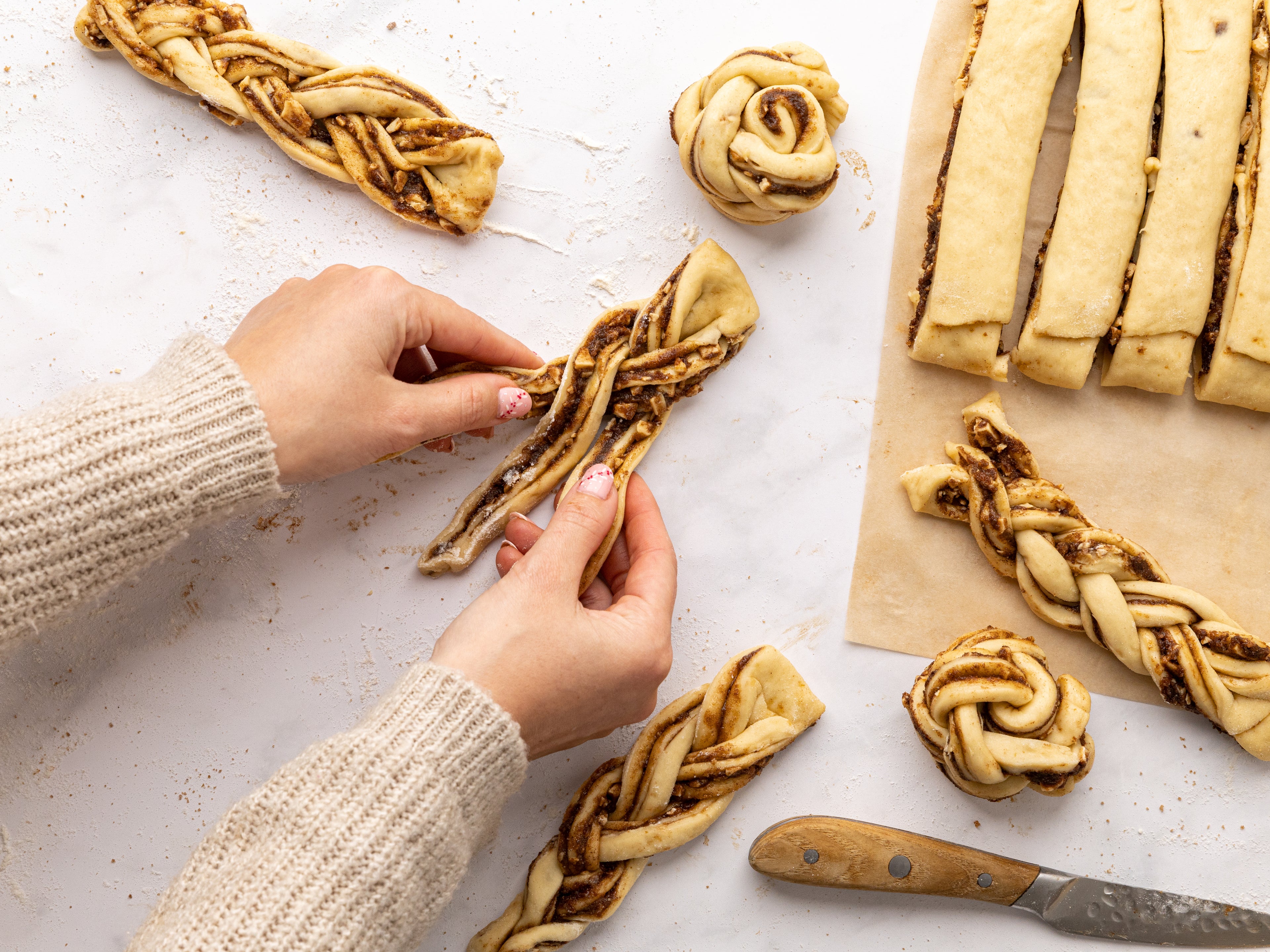 Hand twisting cinnamon dough