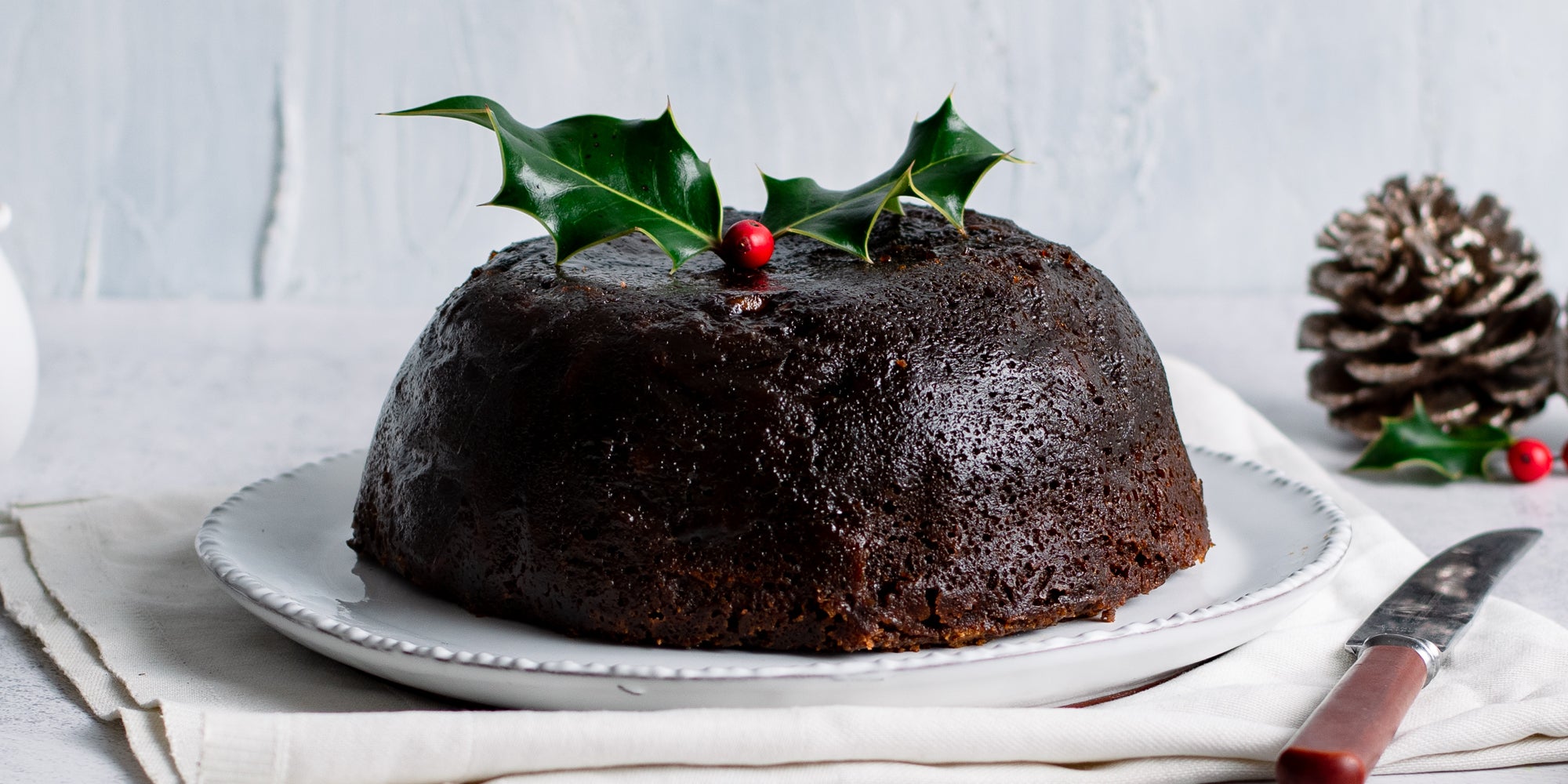 Last Minute Christmas Pudding without a topping, decorated with a piece of holly