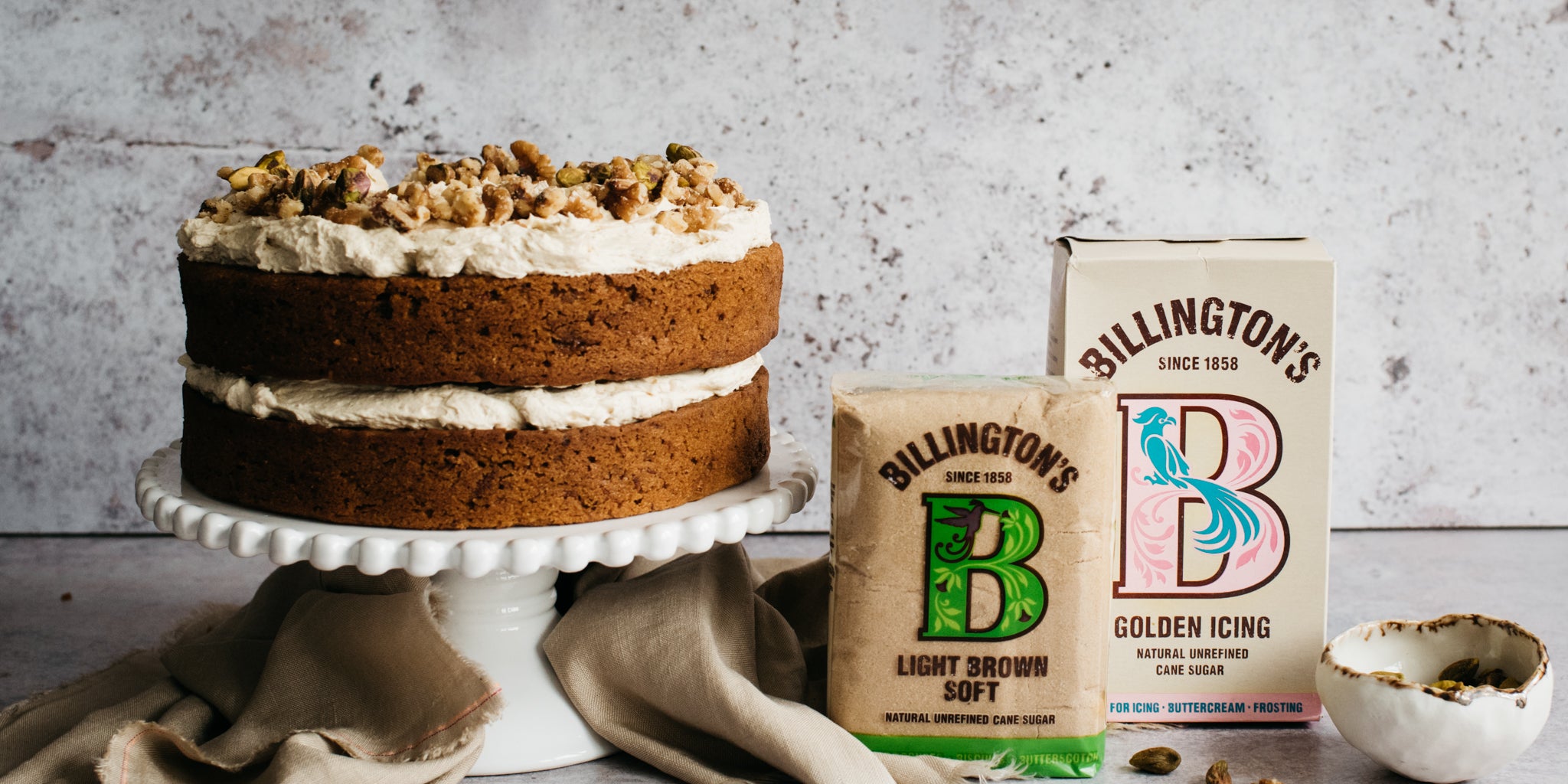 Vegan Carrot Cake next to a box of Billington's Light Soft Brown Sugar, and Golden Icing Sugar