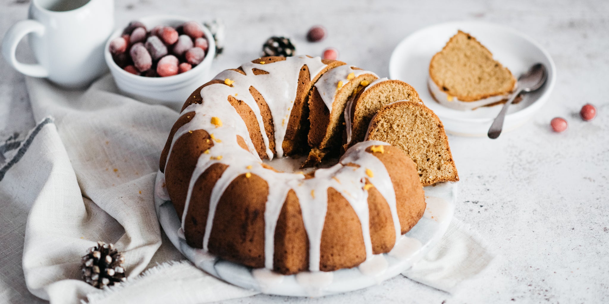 Gingerbread Bundt Cake on a plate with 4 slices removed from it