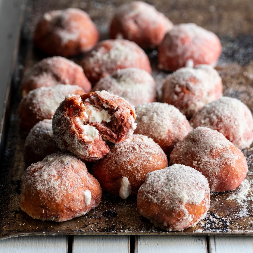 Red velvet doughnuts filled with a cream cheese filling