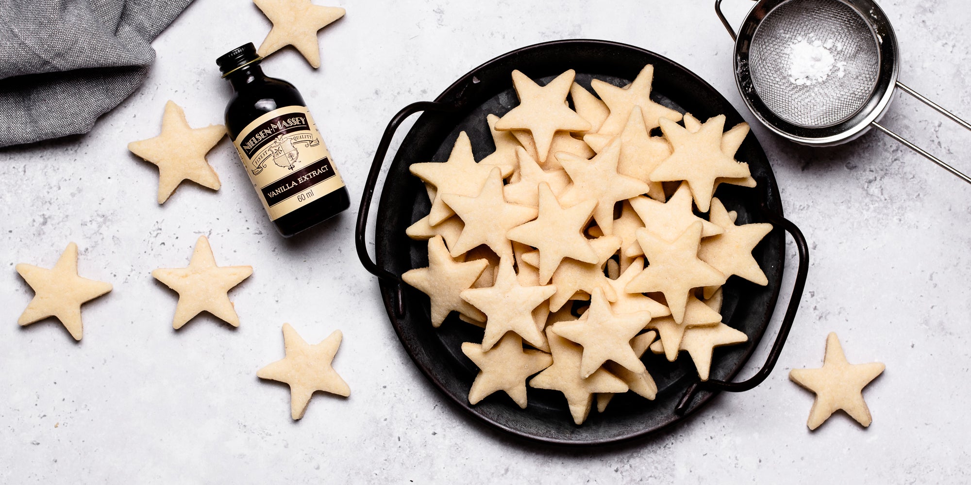 Top down view of star shaped vegan biscuits in a bowl