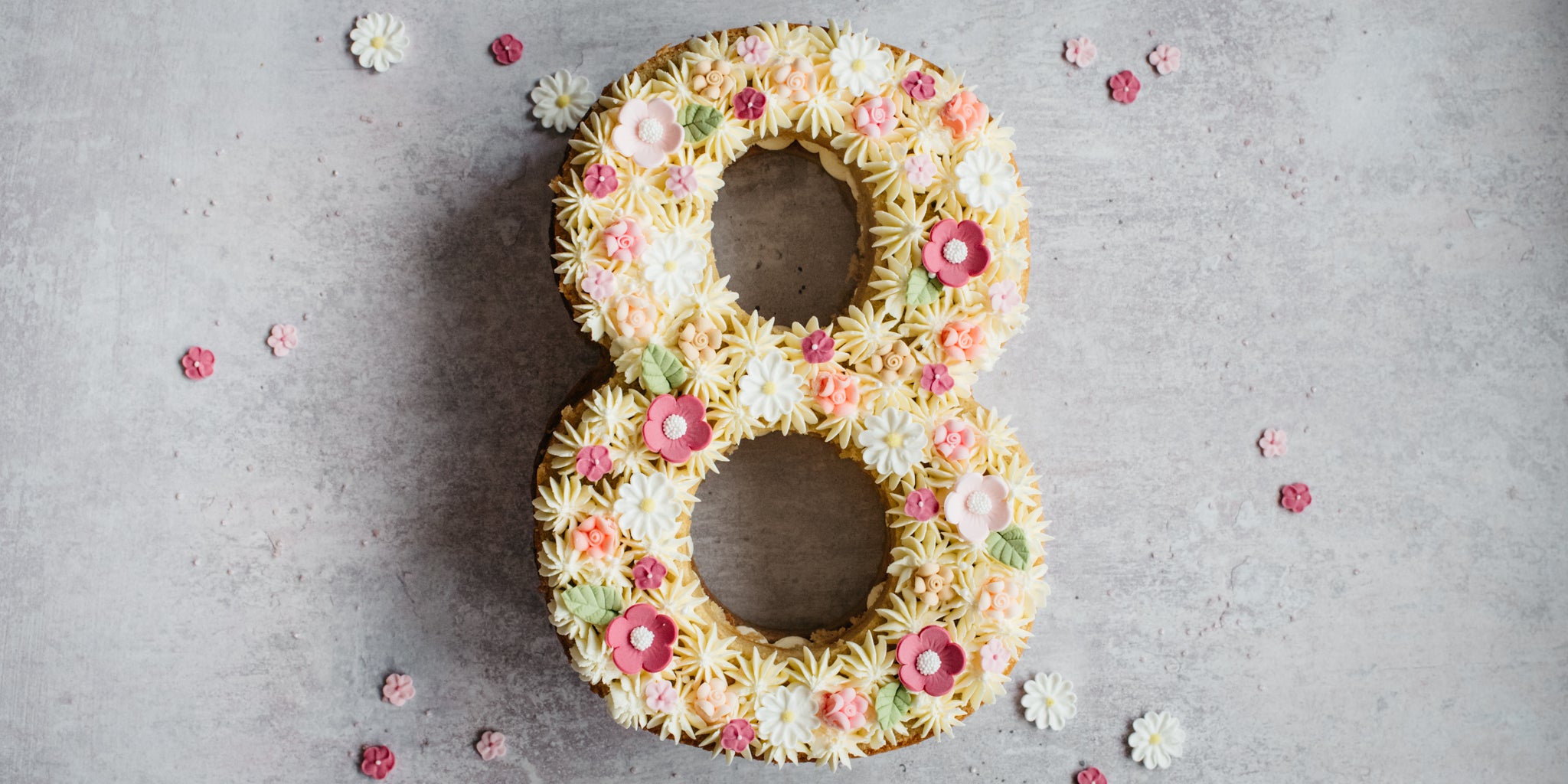 Top view of Number Cake decorated with icing shapes and Vanilla Buttercream piping