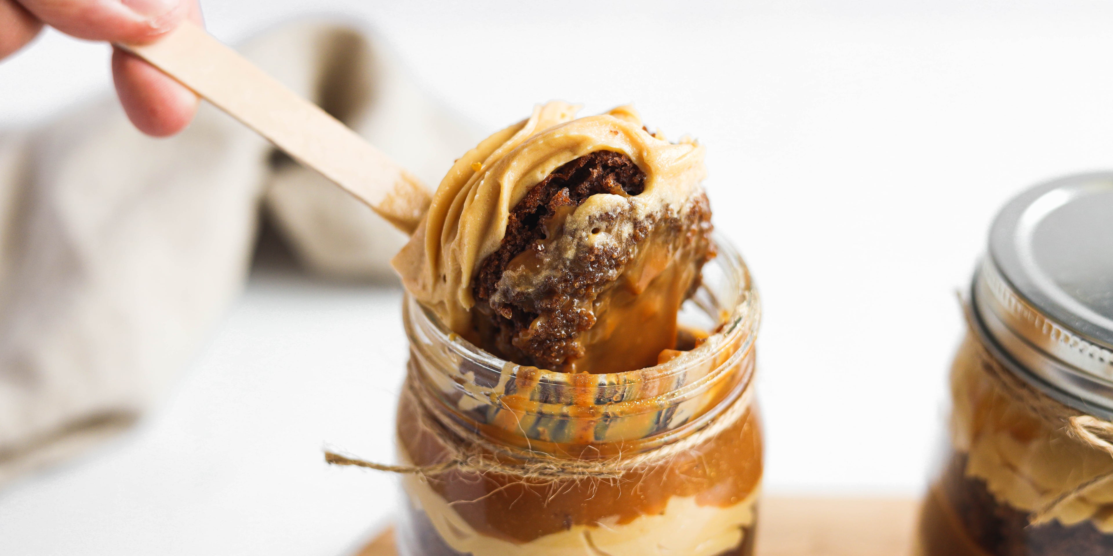 Close up Caramel Cake in a Jar with a scoop of cake on a spoon