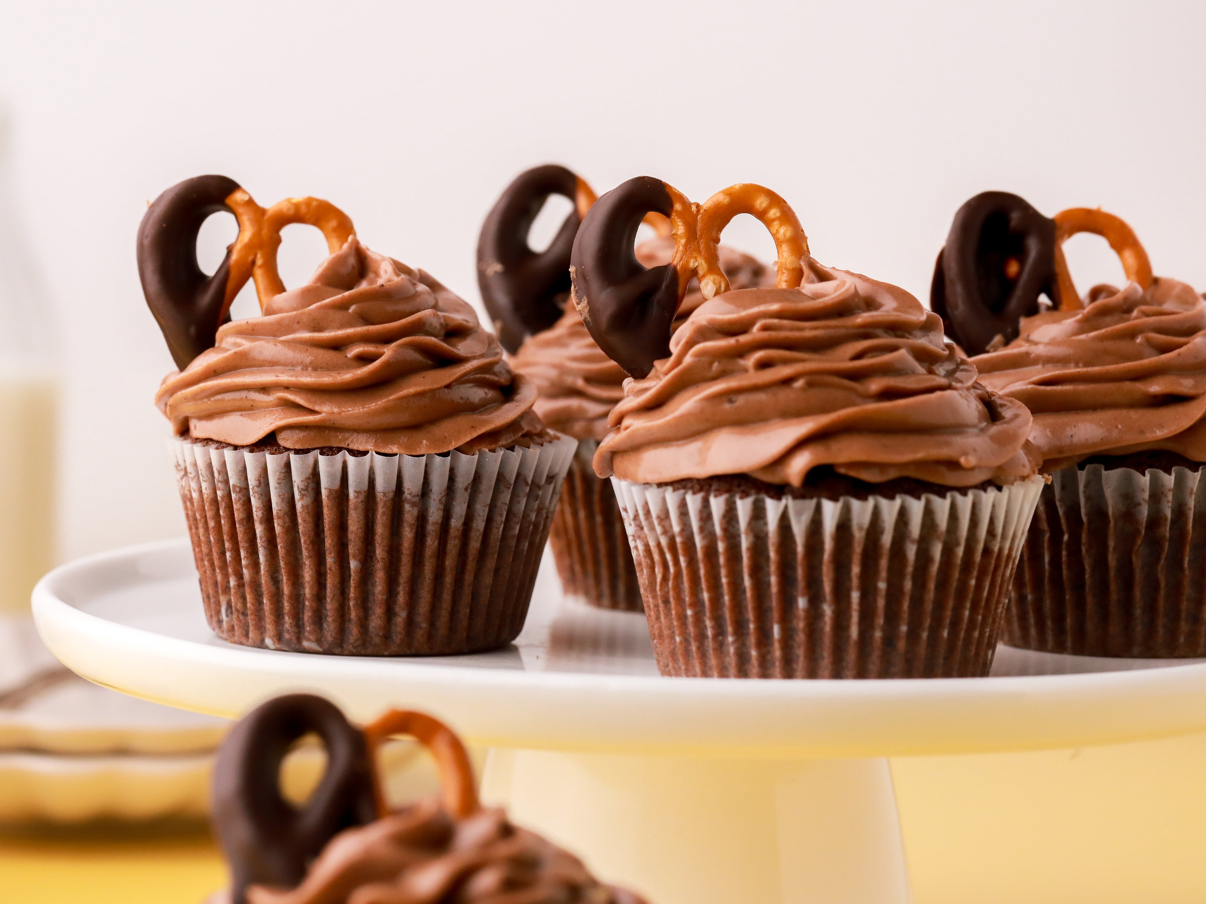 Chocolate cupcakes topped with pretzels