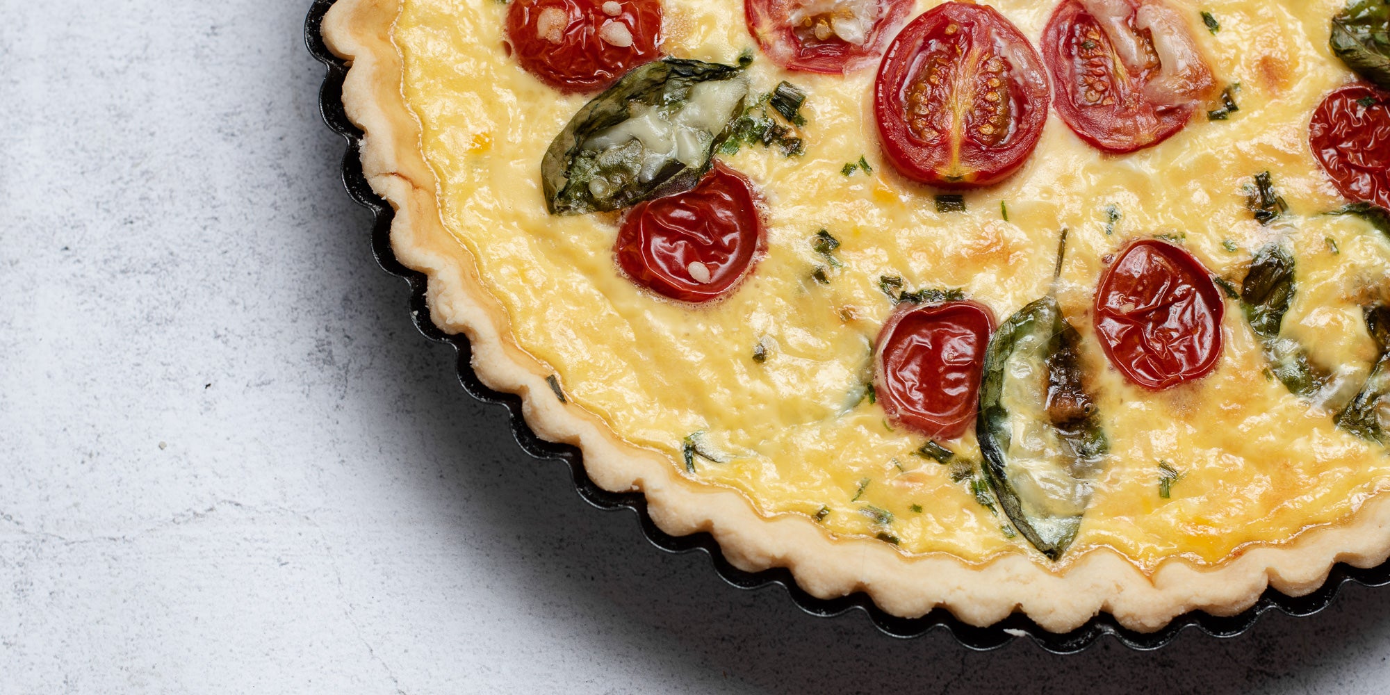 Close up of a Cheese & Tomato Quiche