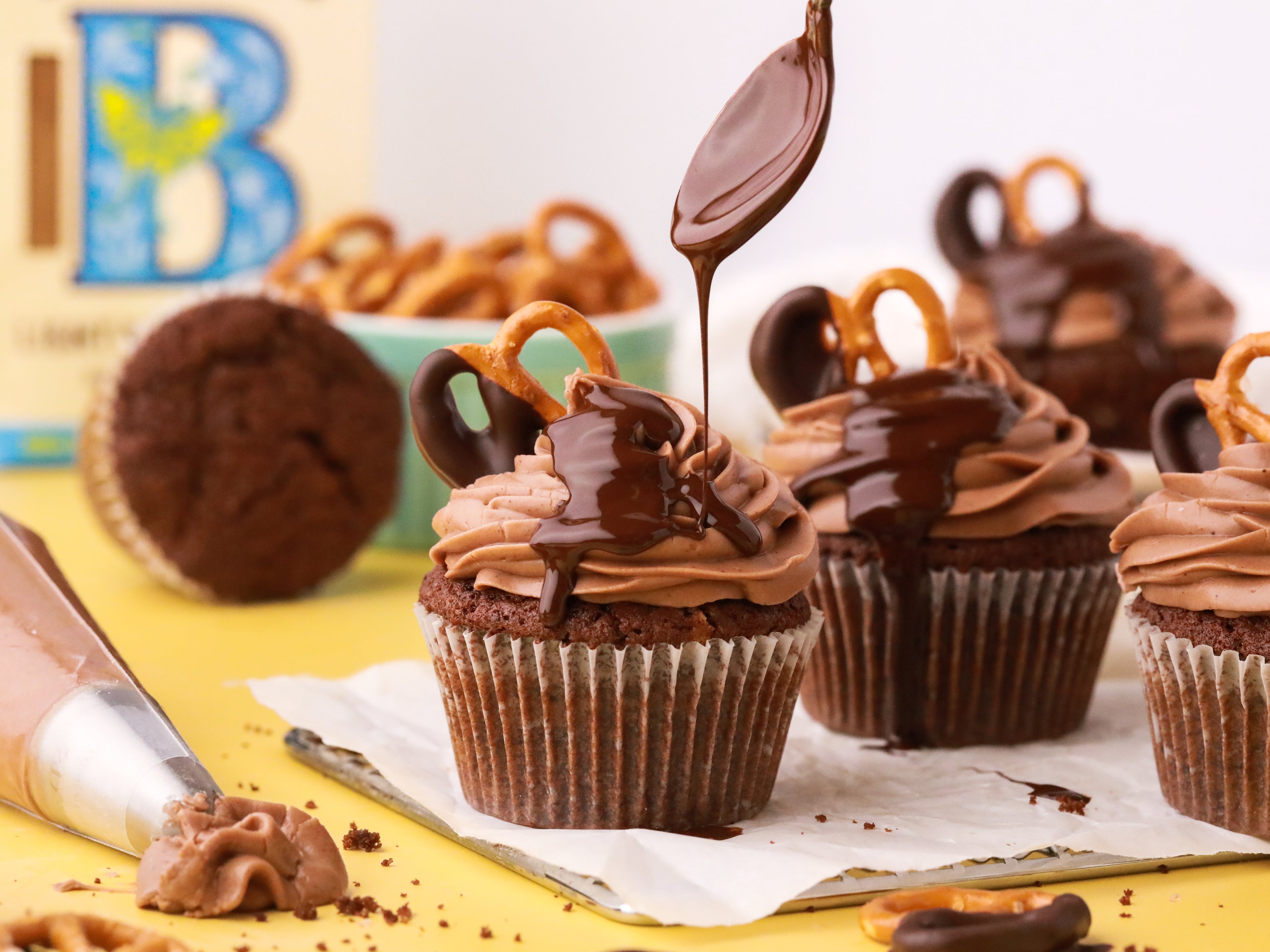 Chocolate drizzled on top of cupcakes