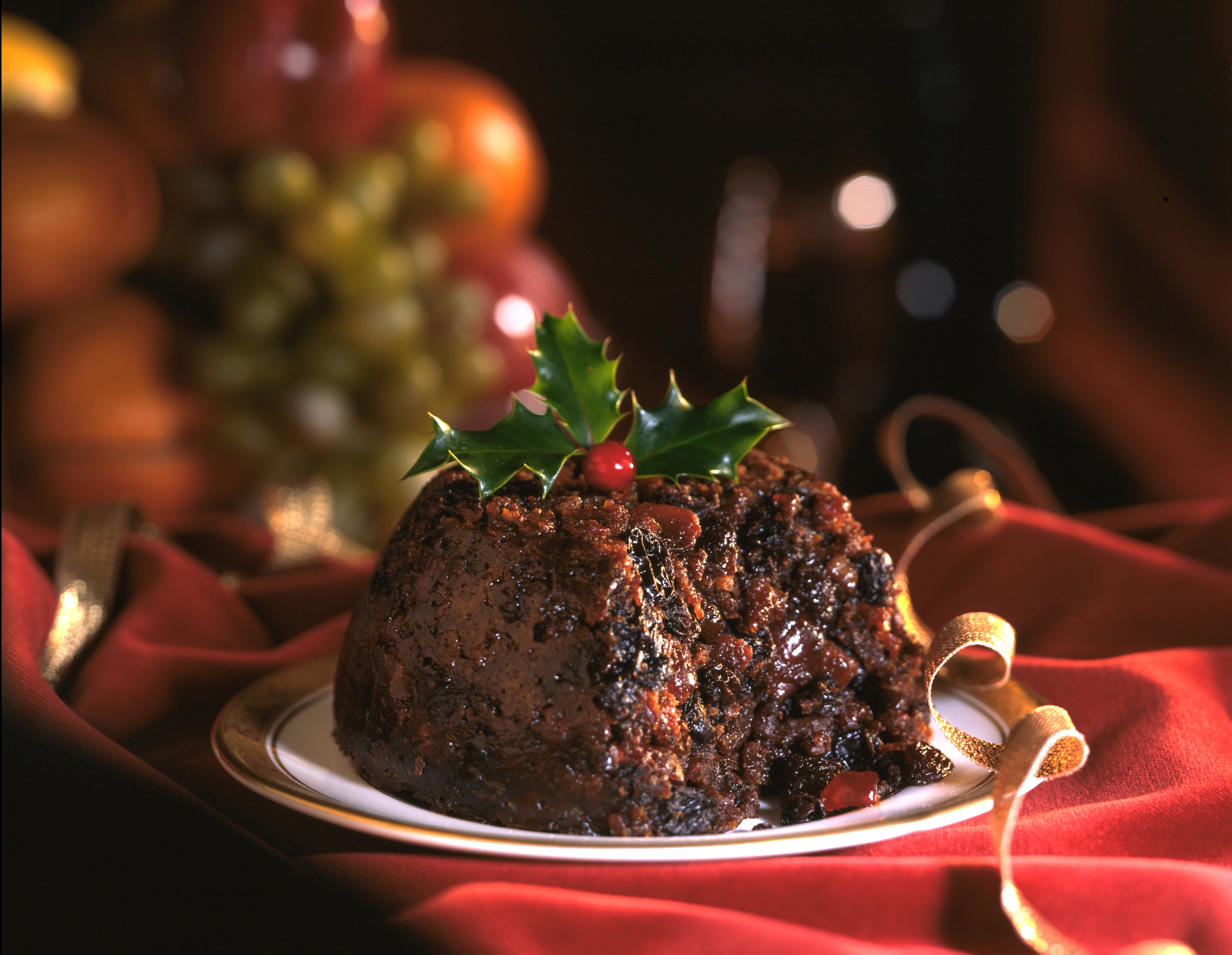 Christmas pudding with holly and ribbons
