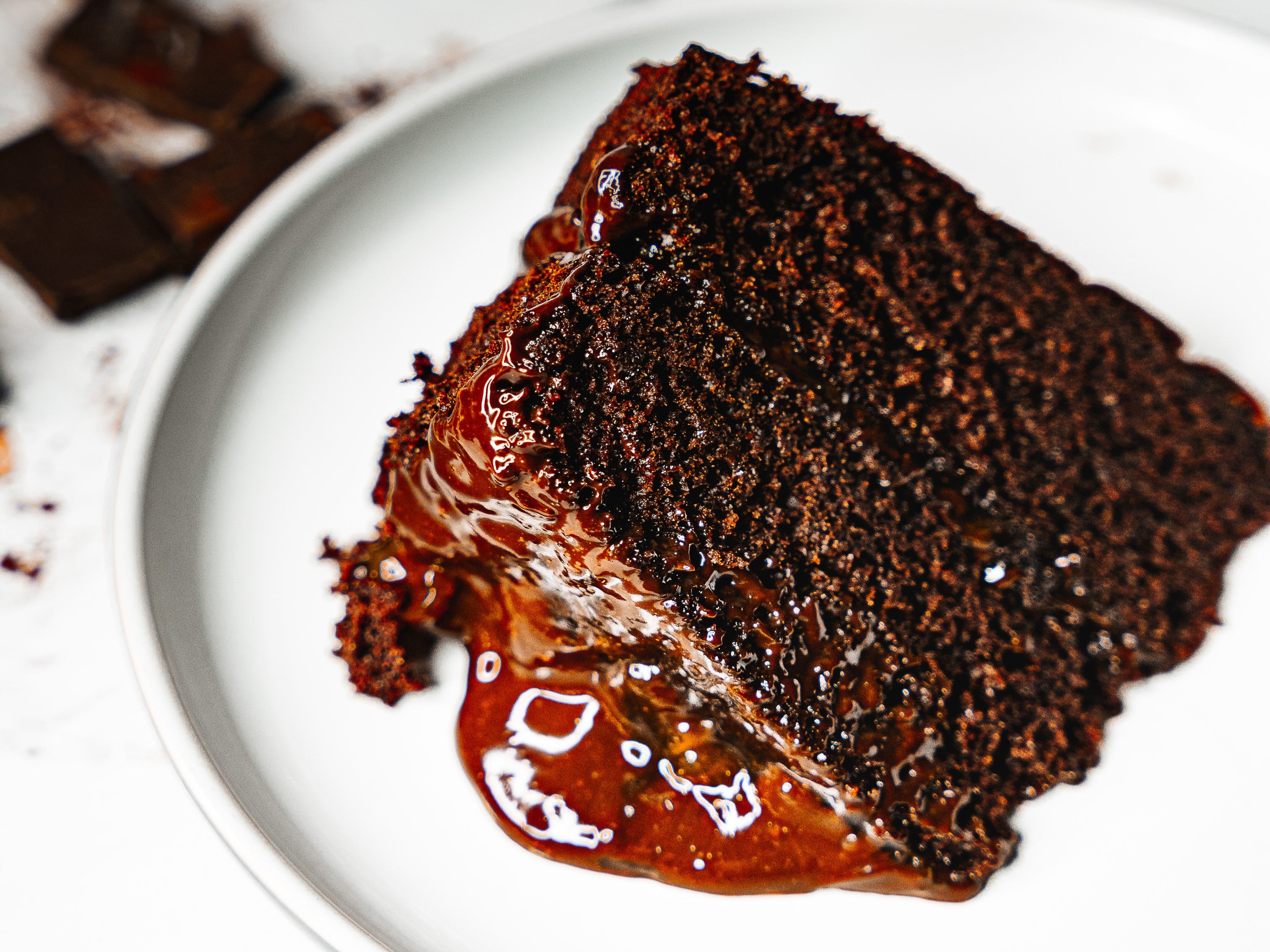 Slice of freshly-baked chocolate cake made using Nigella Lawson's recipe