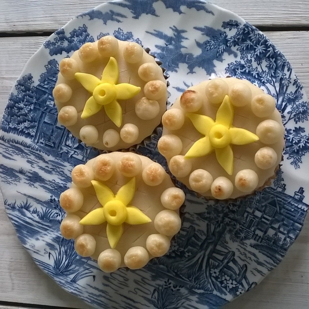 Simnel cupcakes with marzipan daffodil decorations