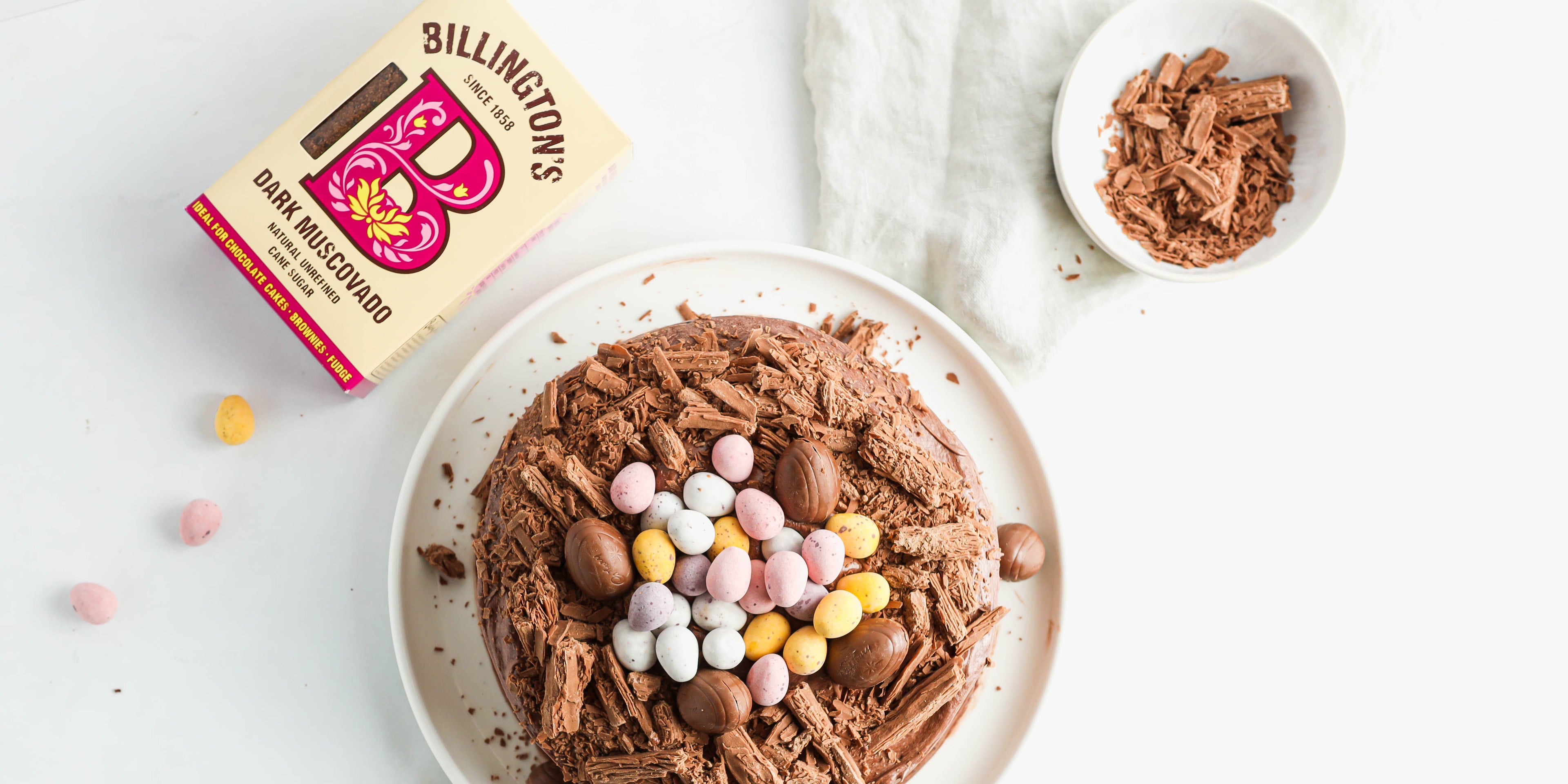 Top view of Chocolate Nest Cake decorated with flake pieces and and chocolate eggs