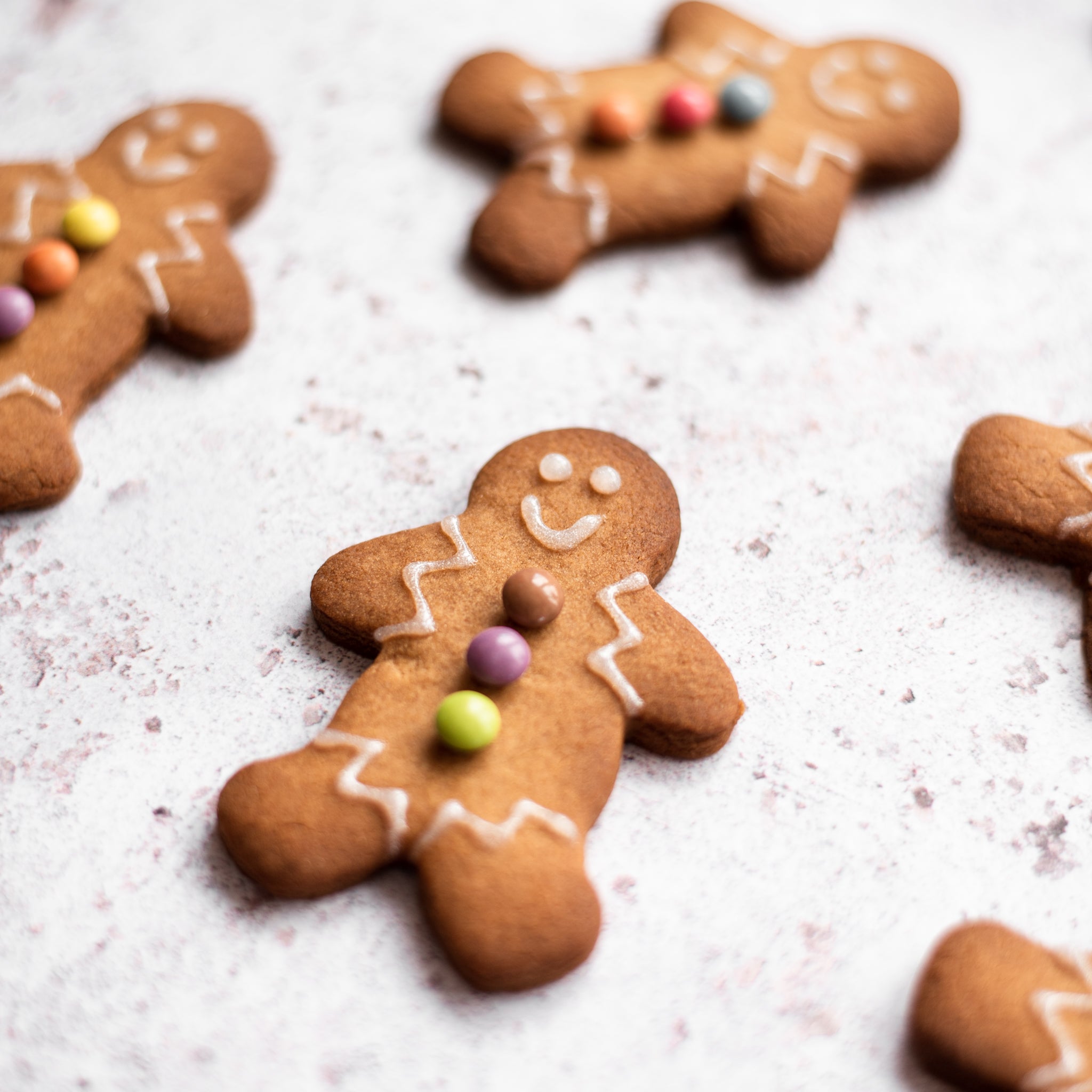 Christmas gingerbread man with icing and buttons made of sweets