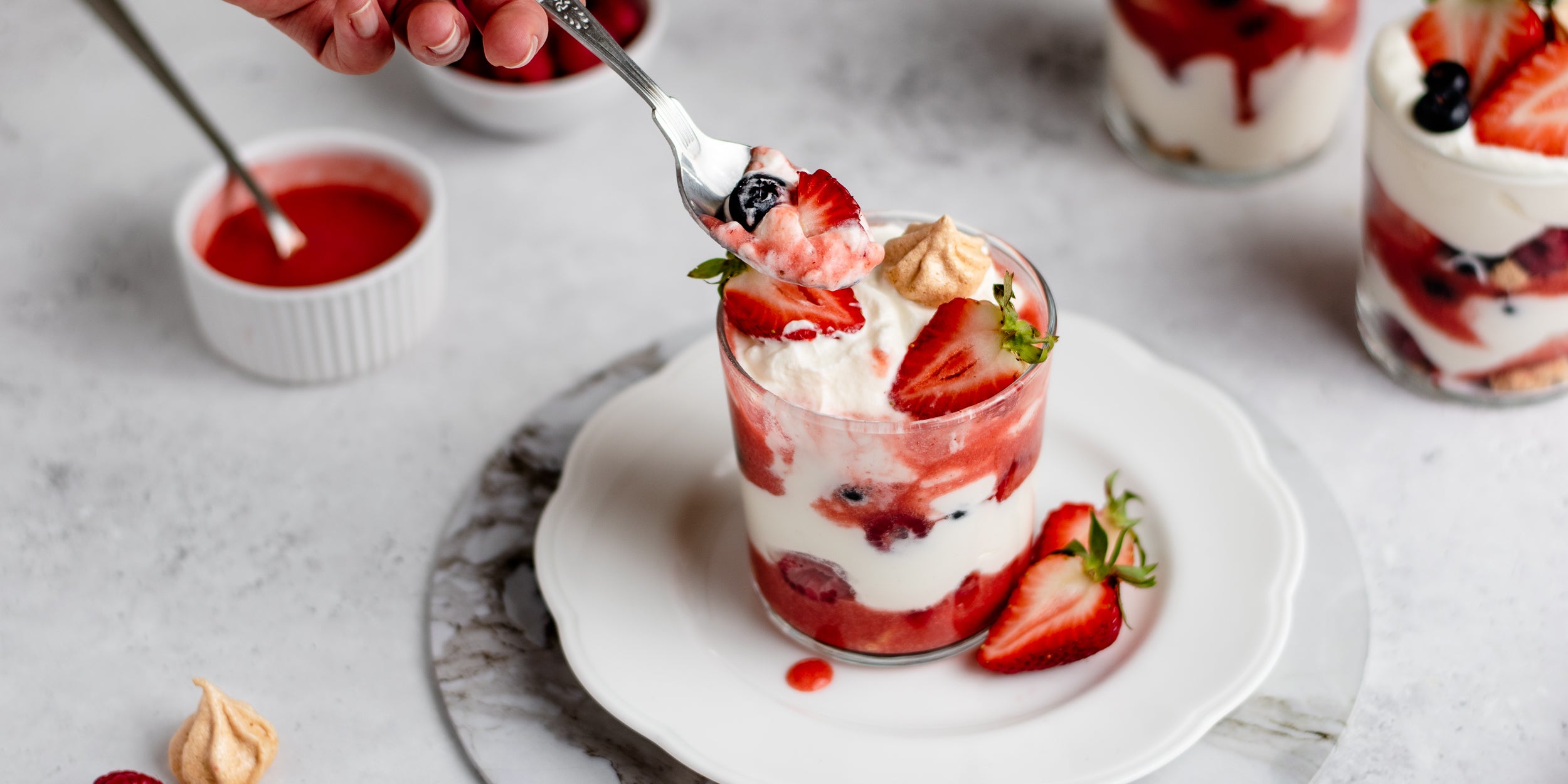 Close up of Summer Berry Eton Mess being scooped up with a spoon