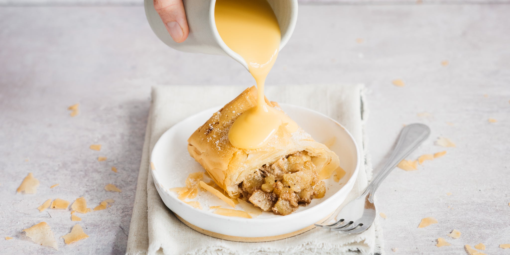 Apple strudel with cut poured on top