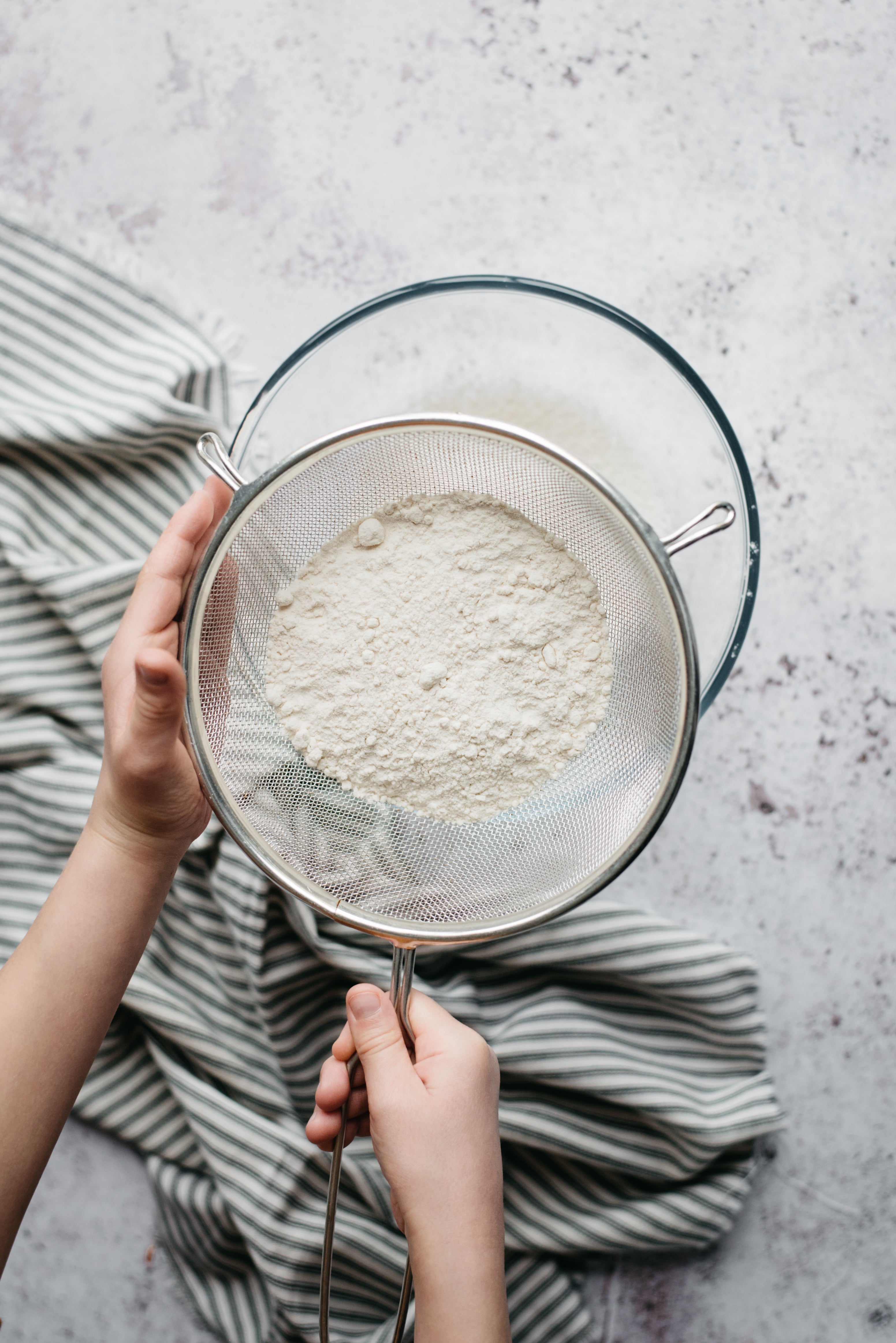flour sifting into a bowl
