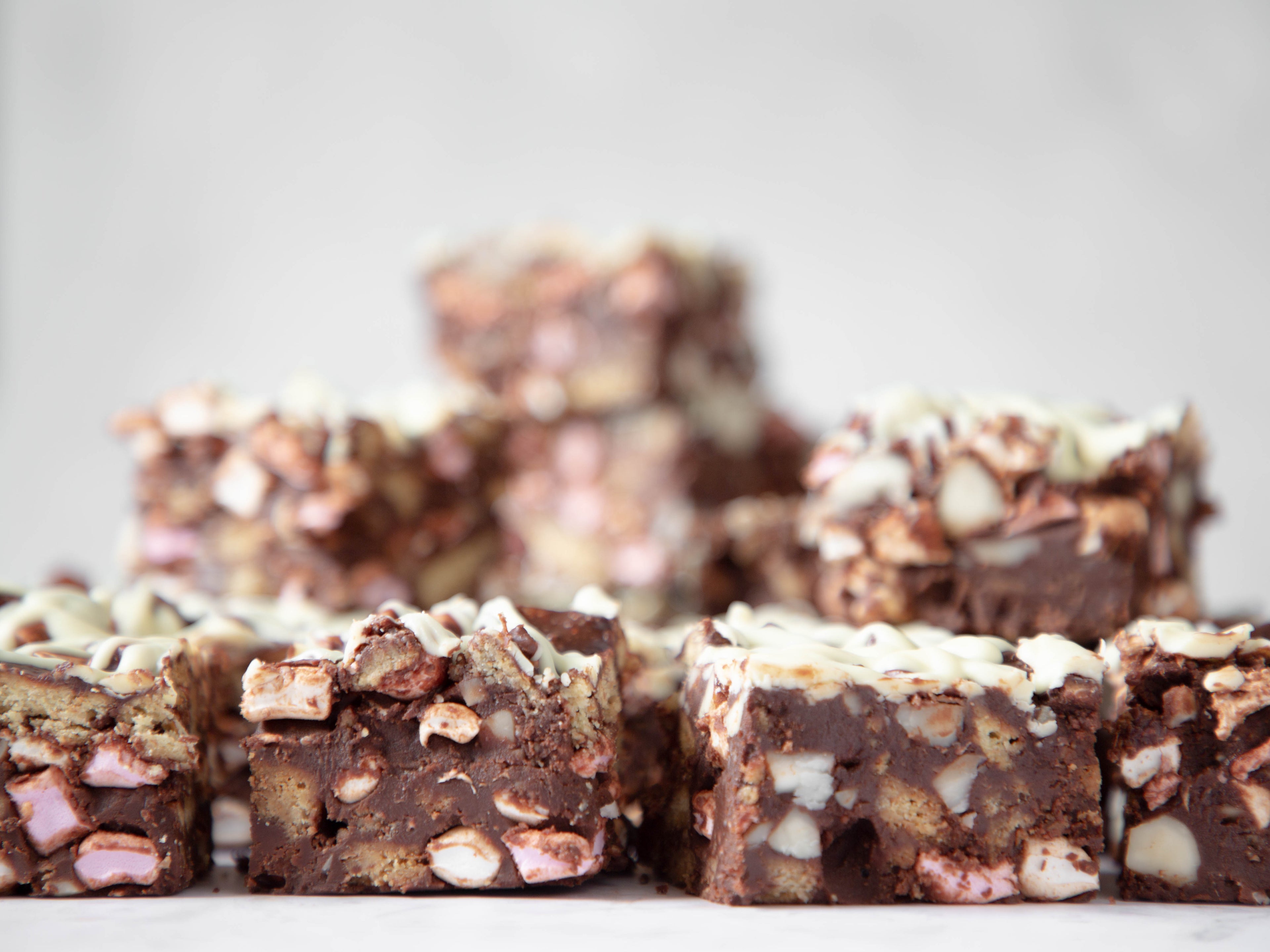 Close up of rocky road squares stacked on top of each other