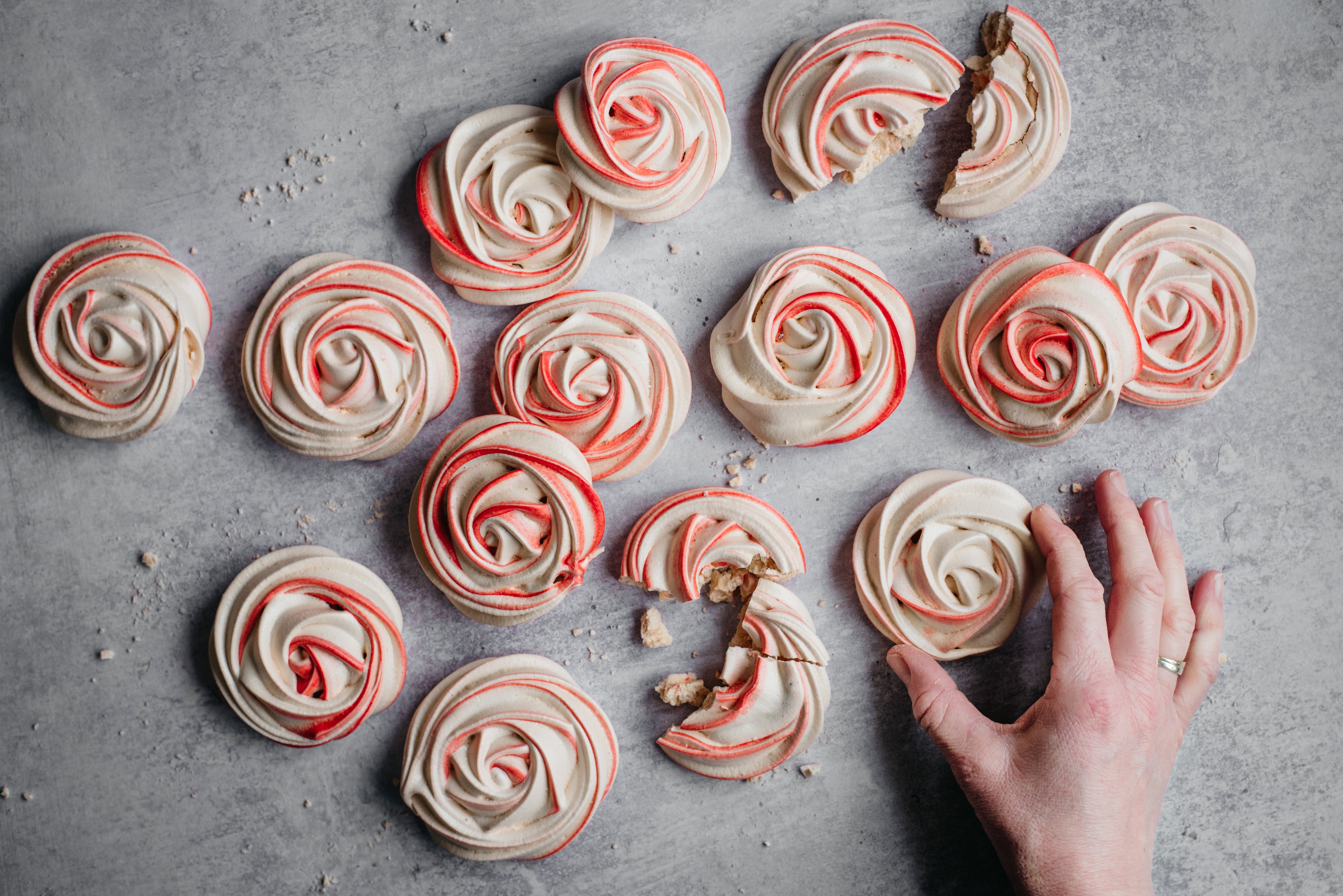 Hand reaching for a Vegan Meringue