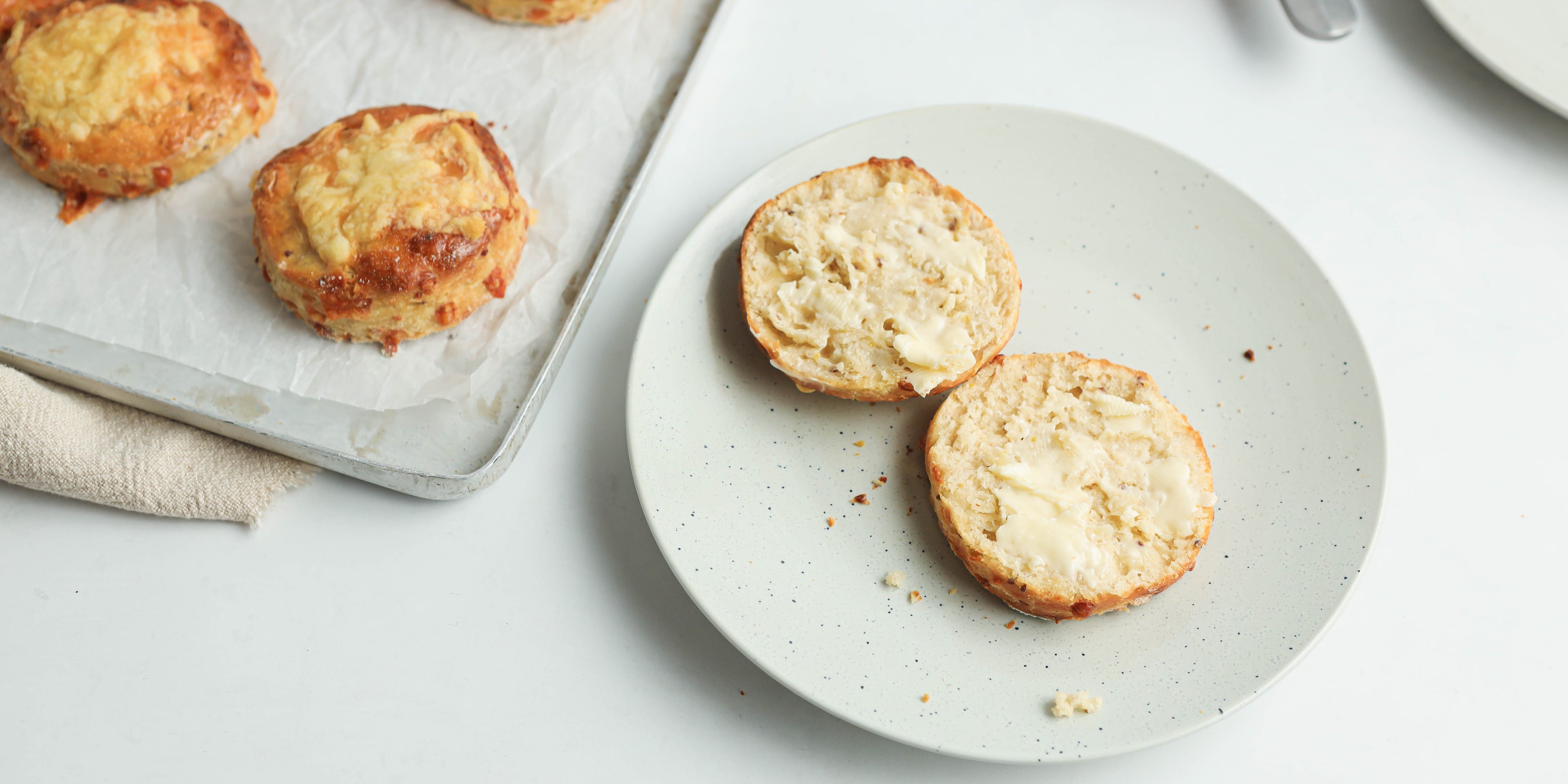 Cheese Scones cut into halves served on a plate