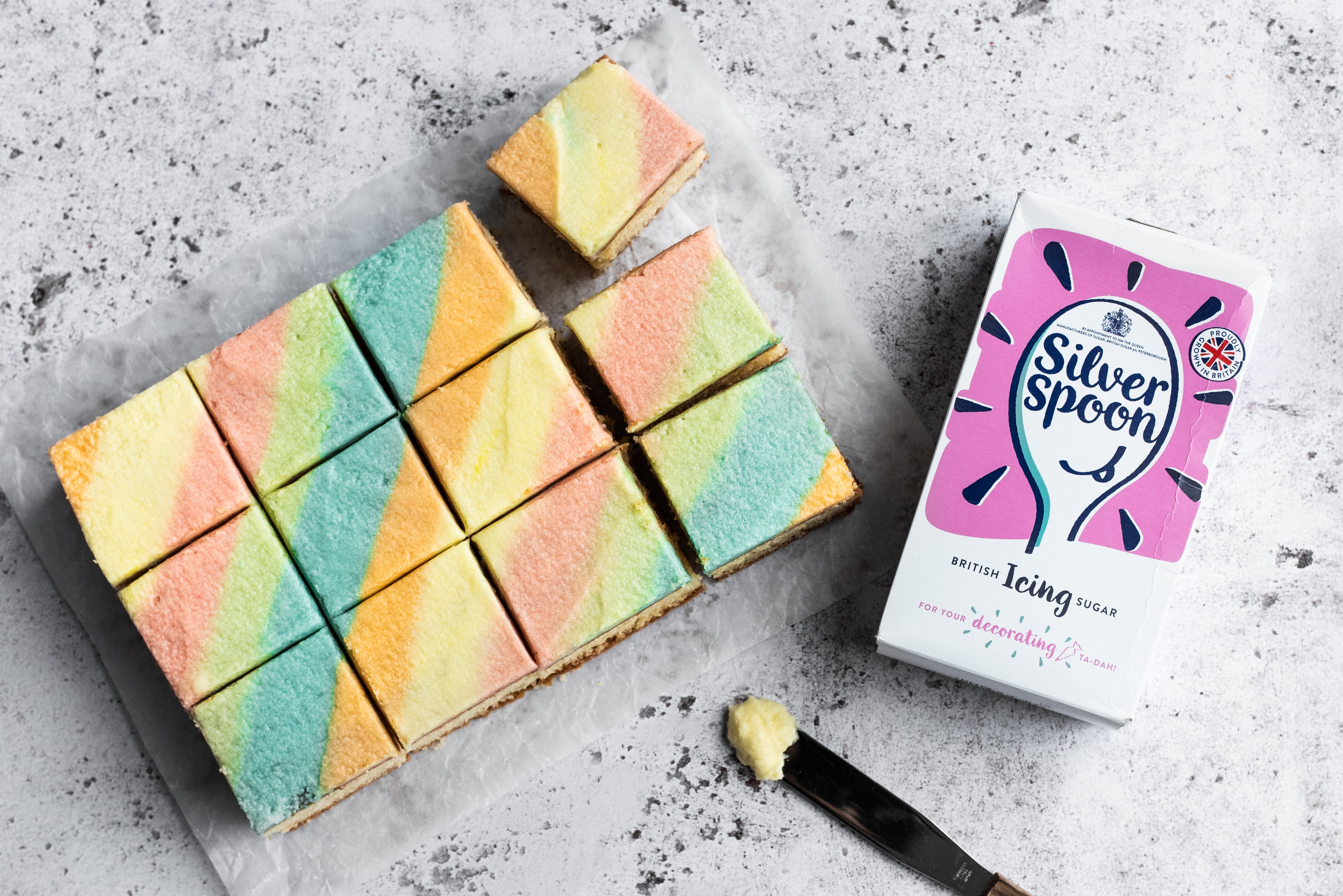 rainbow buttercream on a traybake