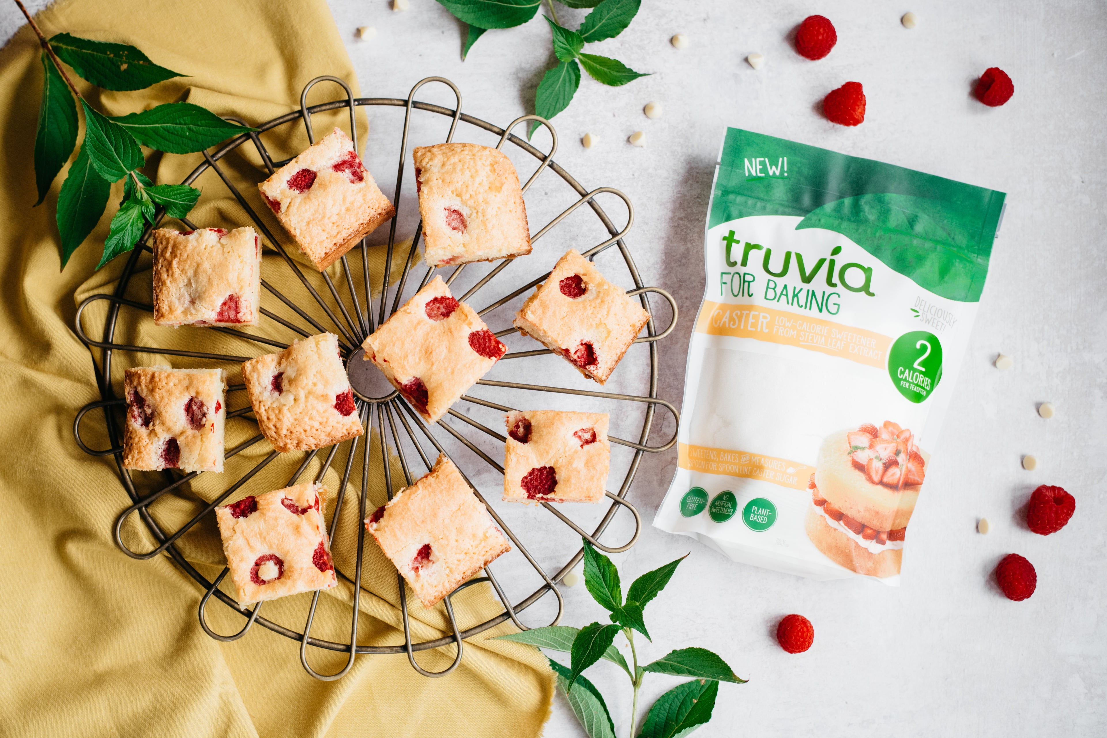 Top down view of some blondies next to a pack of truvia for baking brown