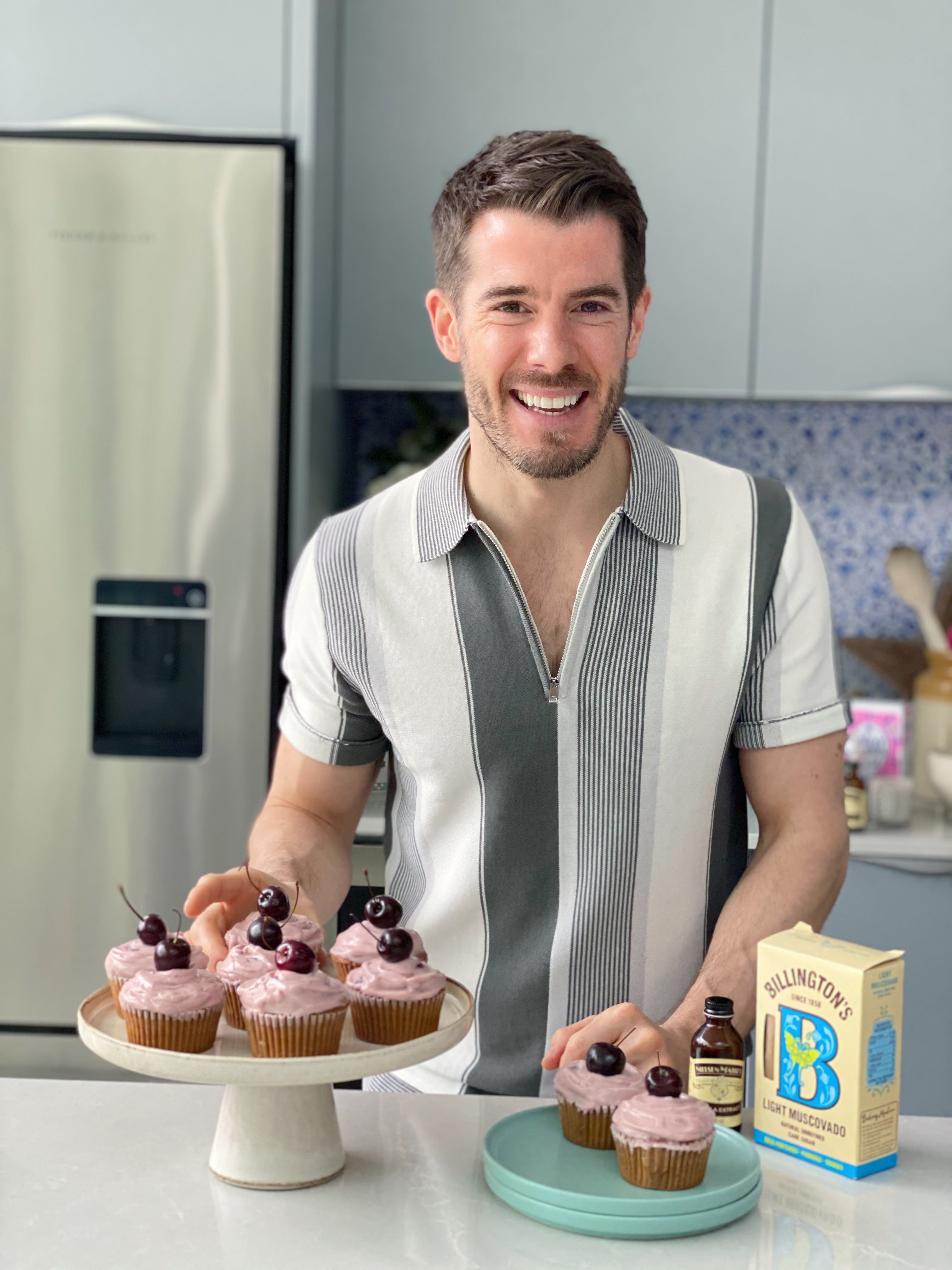 John Gregory Smith with Cherry and Pistachio Cupcakes on a cake stand